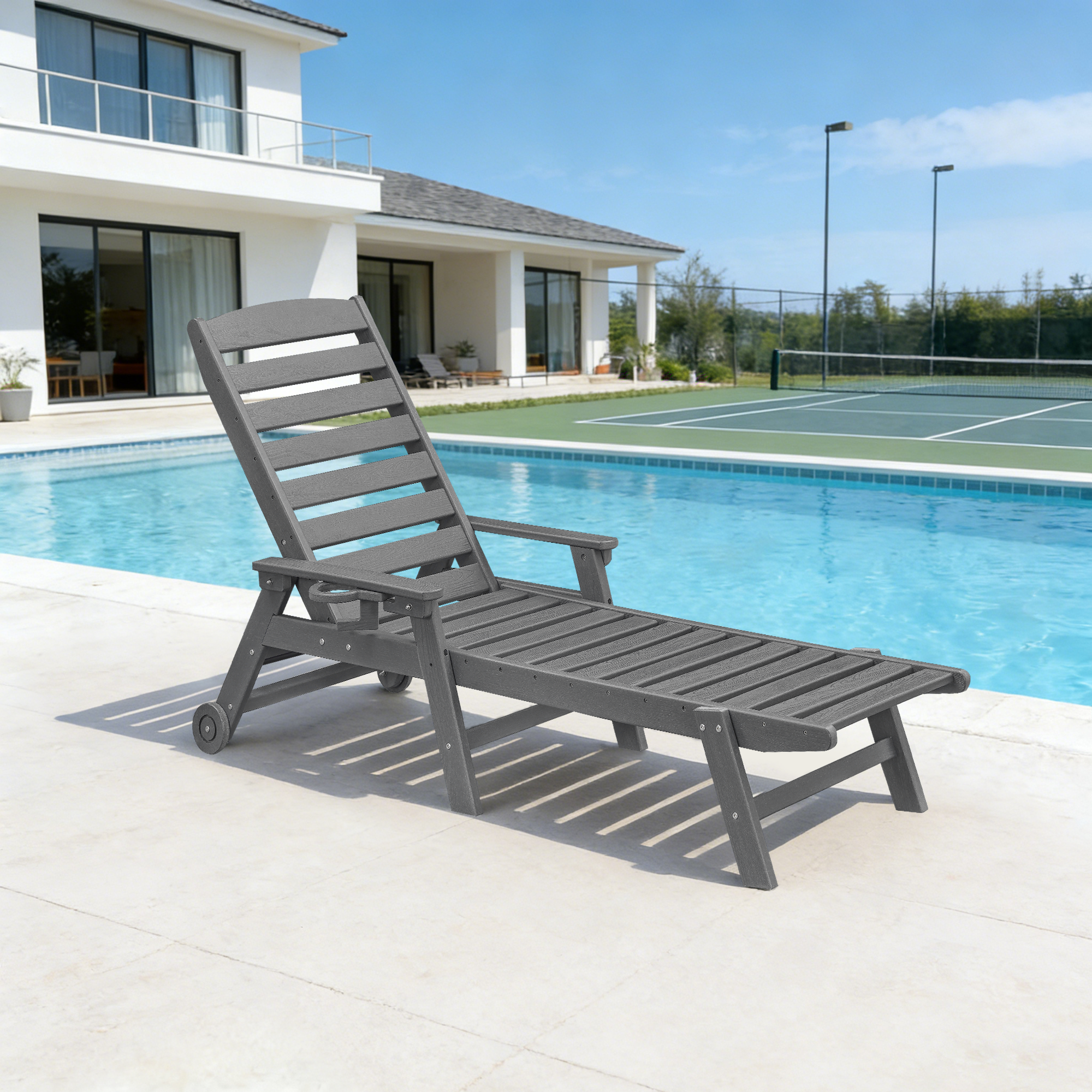 Gray adjustable outdoor lounge chair with wheels by a pool and tennis court -Seehill