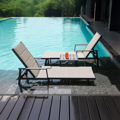 Outdoor lounge chairs with side table by pool - Seehill