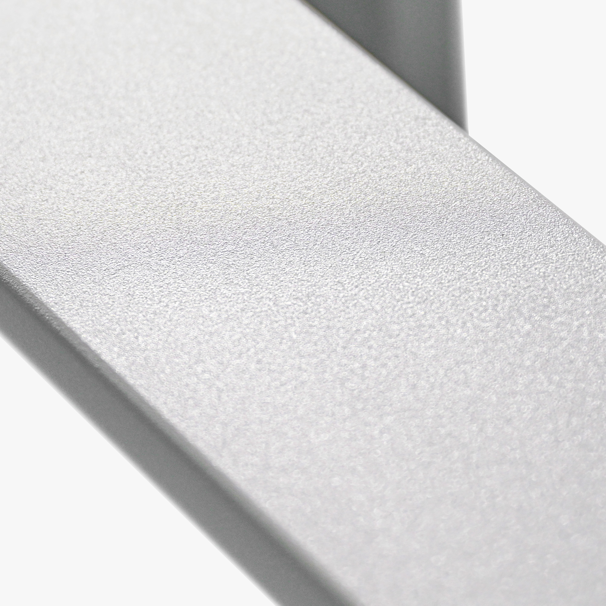 Close-up of textured silver metal frame detail on expandable outdoor patio dining table -Seehill