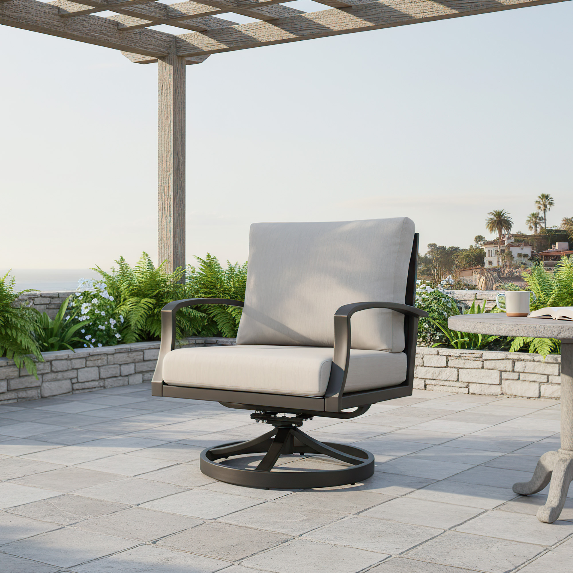 Outdoor swivel patio chair with wide cushioned seating under a pergola by a stone table-Seehill