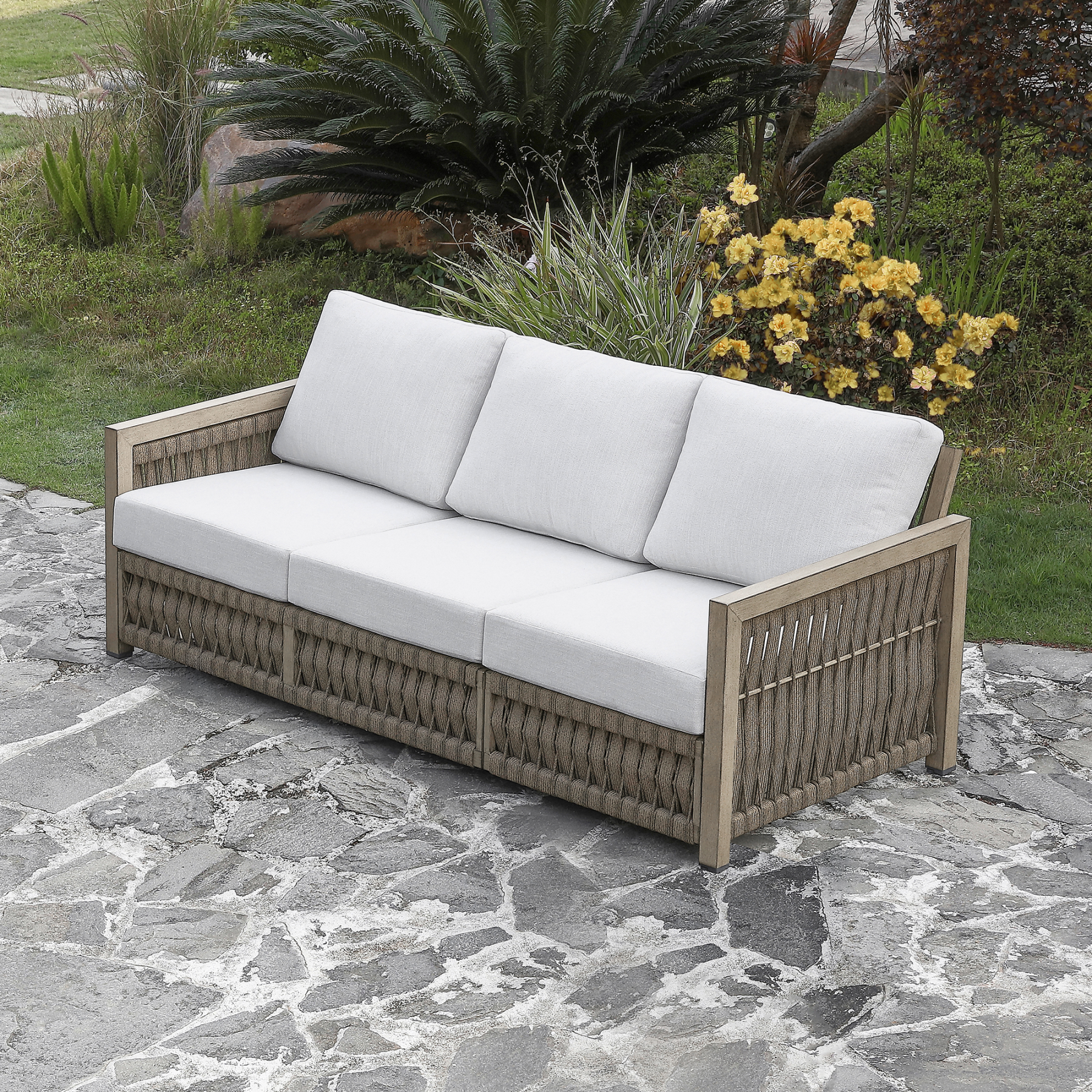 Outdoor wicker sofa with white cushions for patio seating - Seehill