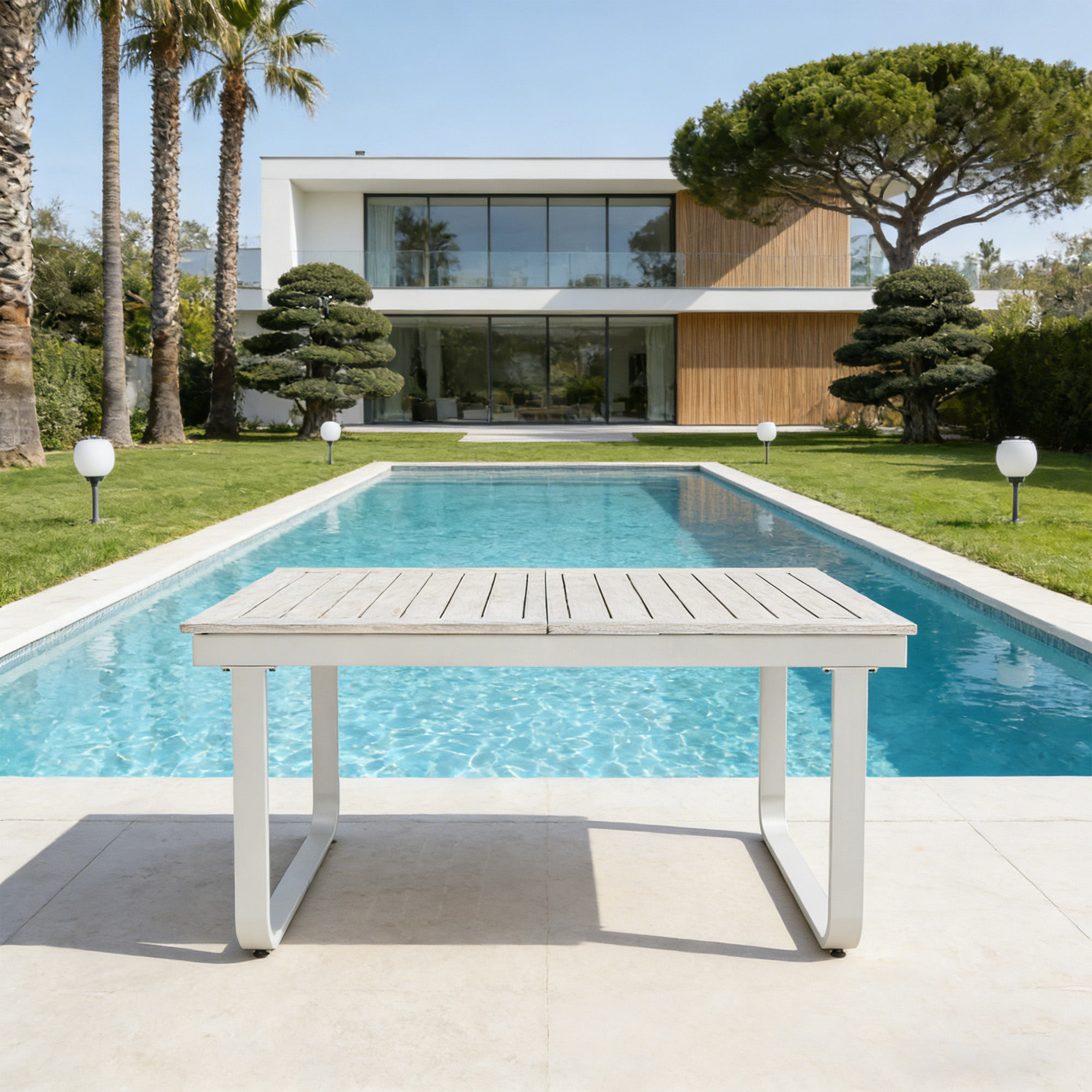 Expandable outdoor dining table with U-shaped legs by a pool in a modern backyard-Seehill