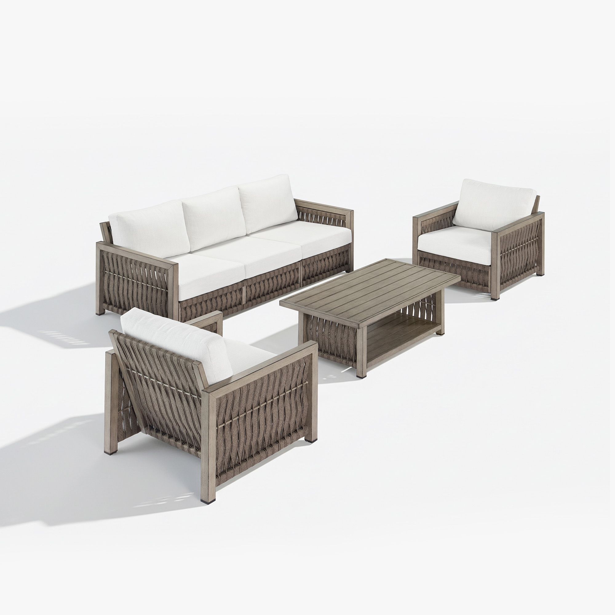 Experience the outdoor wicker patio set with gray woven frames and white cushions in our sophisticated collection. - Seehill