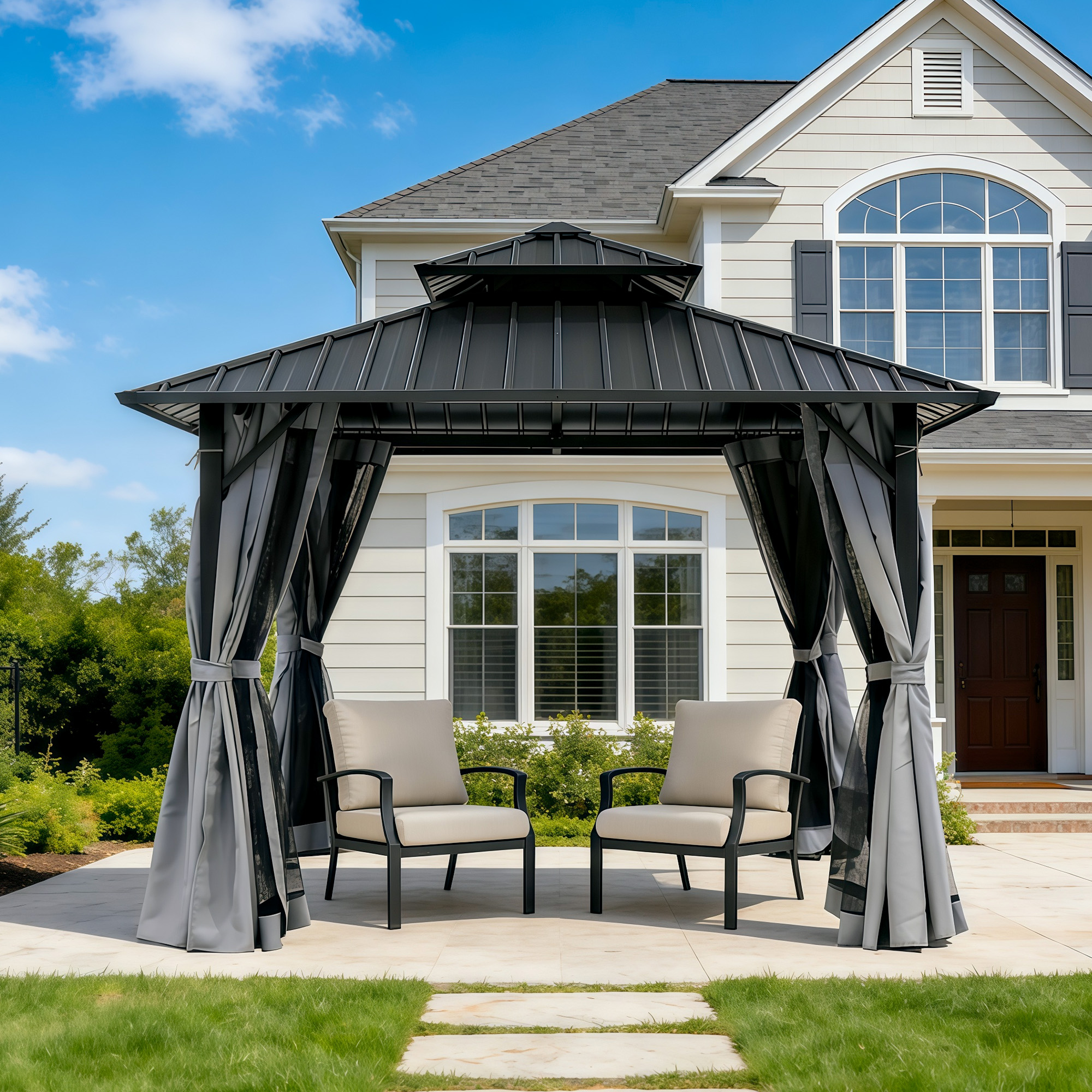 Outdoor patio hardtop gazebo with curtains and two cushioned chairs on a stone patio-Seehill