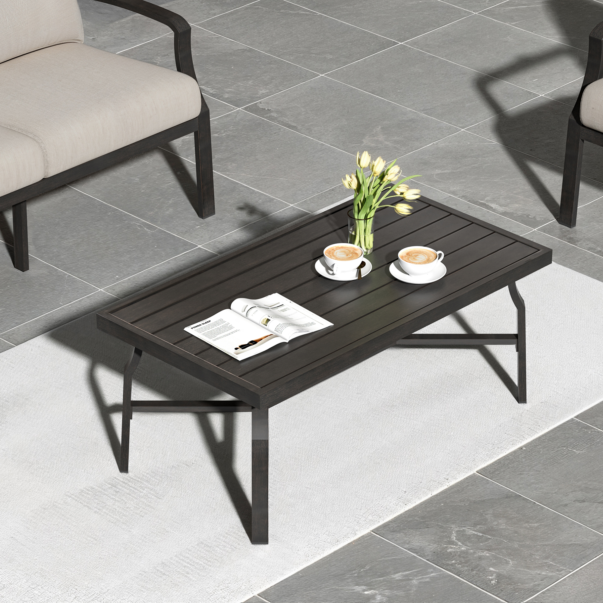 Outdoor patio scene with a dark slatted rectangle coffee table and beige seating-Seehill