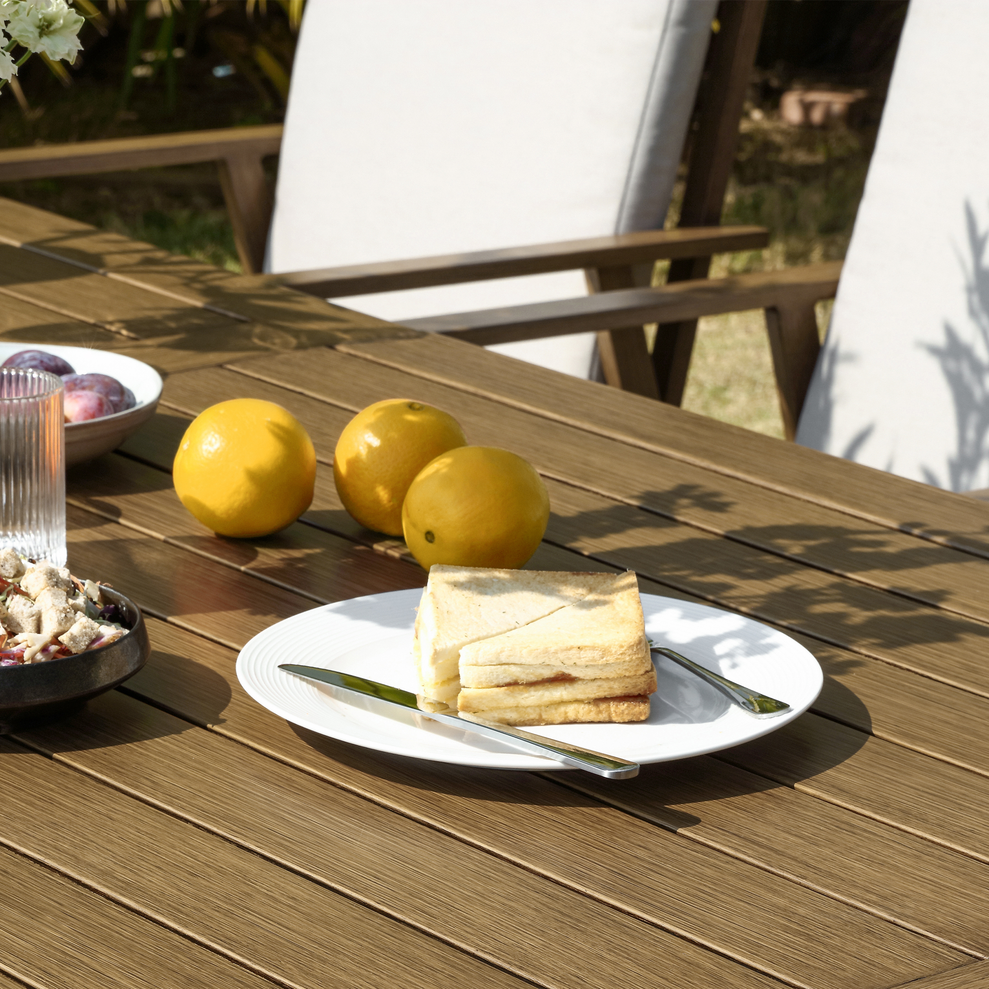 The modern Piece Outdoor Patio Dining Set with aluminum all-weather umbrella hole chairs is highlighted in this image. - Seehill