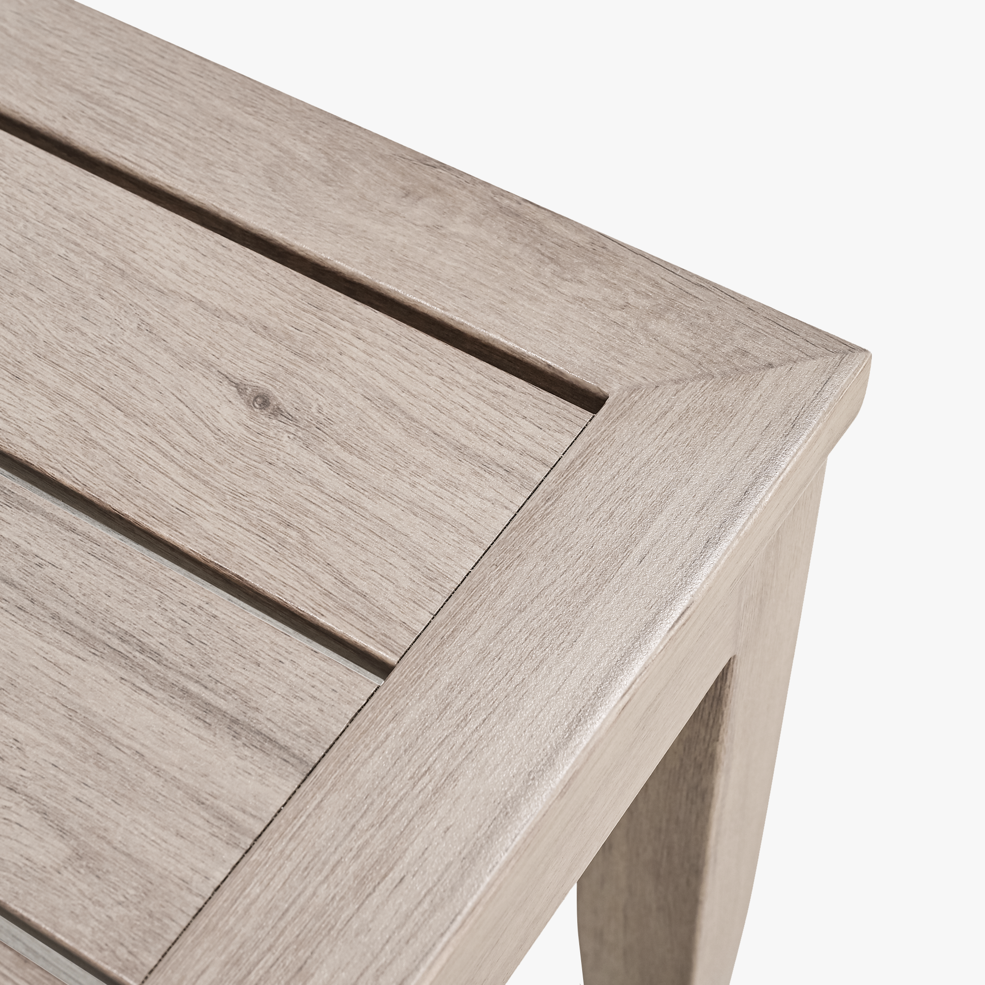 Close-up of patio outdoor coffee table corner with light faux wood grain finish-Seehill