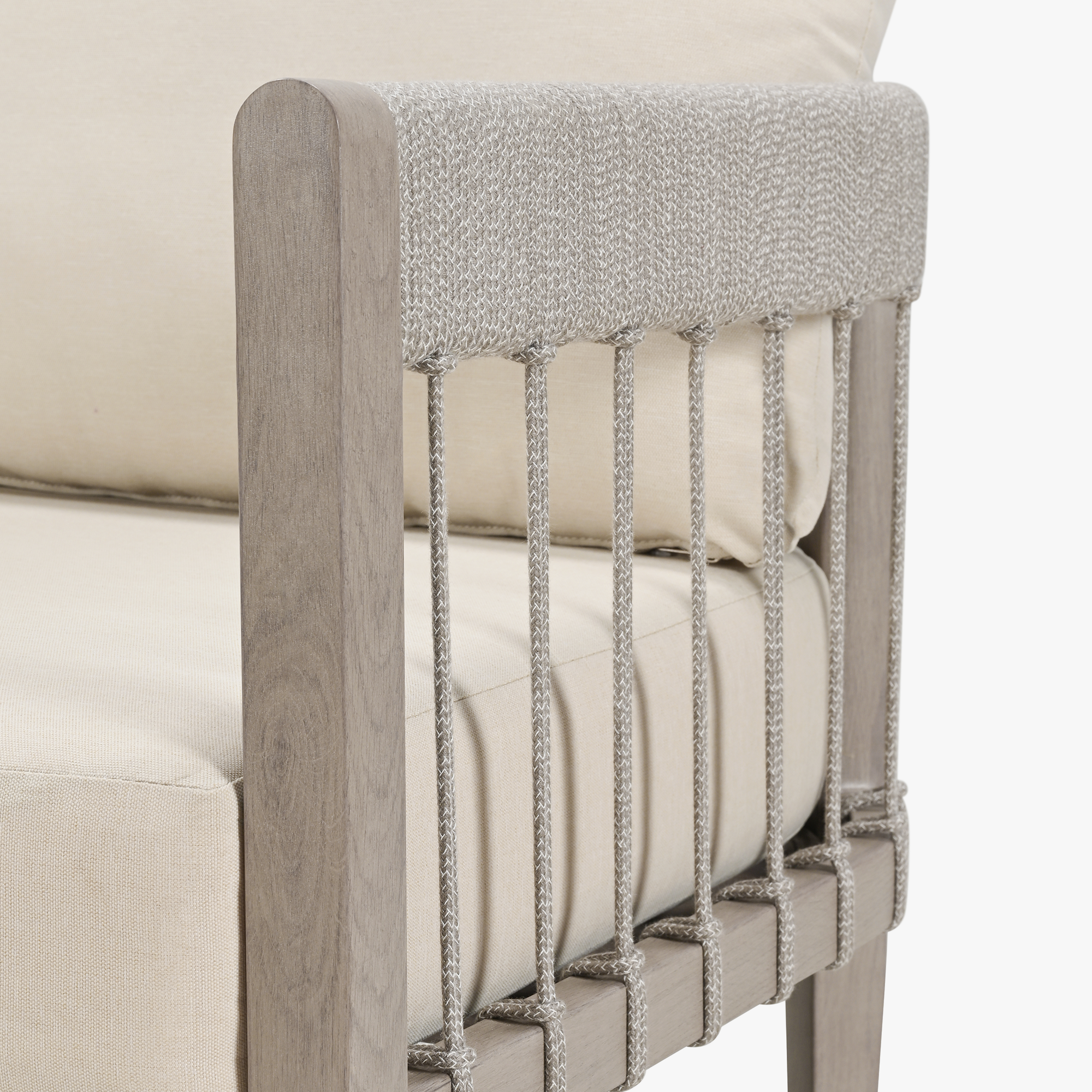 Close-up of patio chair armrest with faux wood grain and woven rope detailing-Seehill