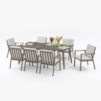 Modern outdoor dining set with gray wood finish and white cushions - Seehill