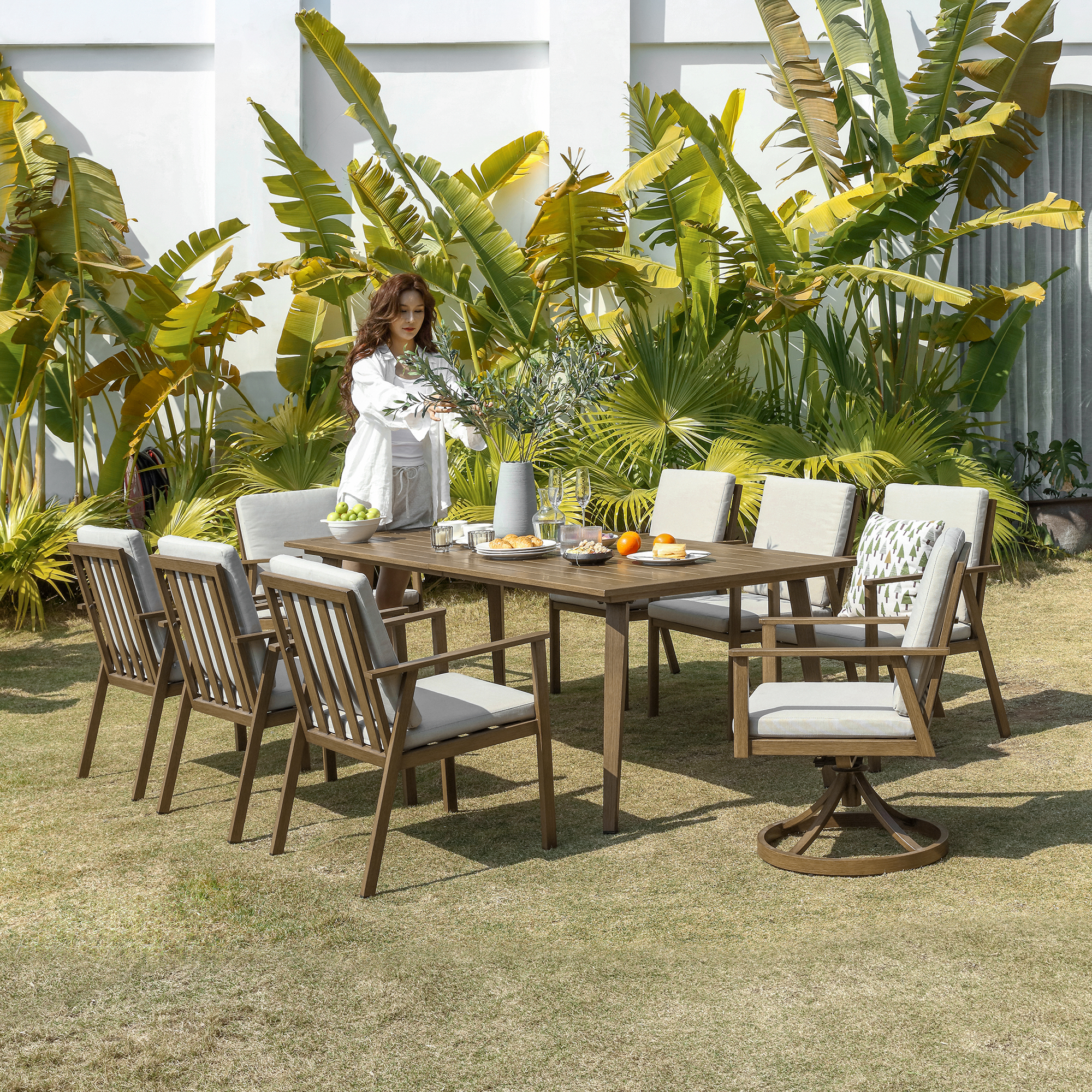 Experience the modern outdoor dining set with swivel chairs in our sophisticated outdoor collection. - Seehill