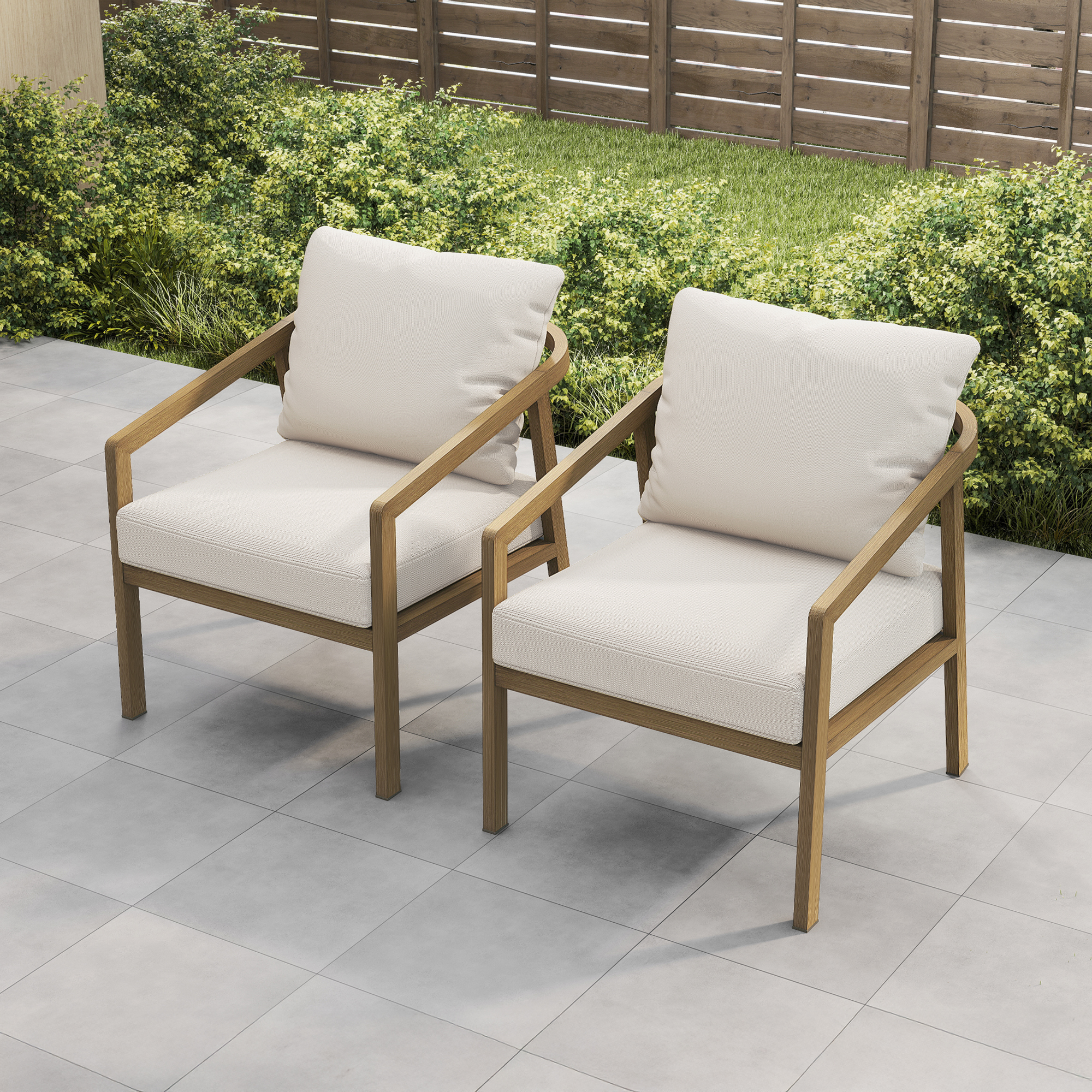 Crafted with modern outdoor armchairs with wooden frames and cream cushions on a patio, this piece offers both comfort and style. - Seehill