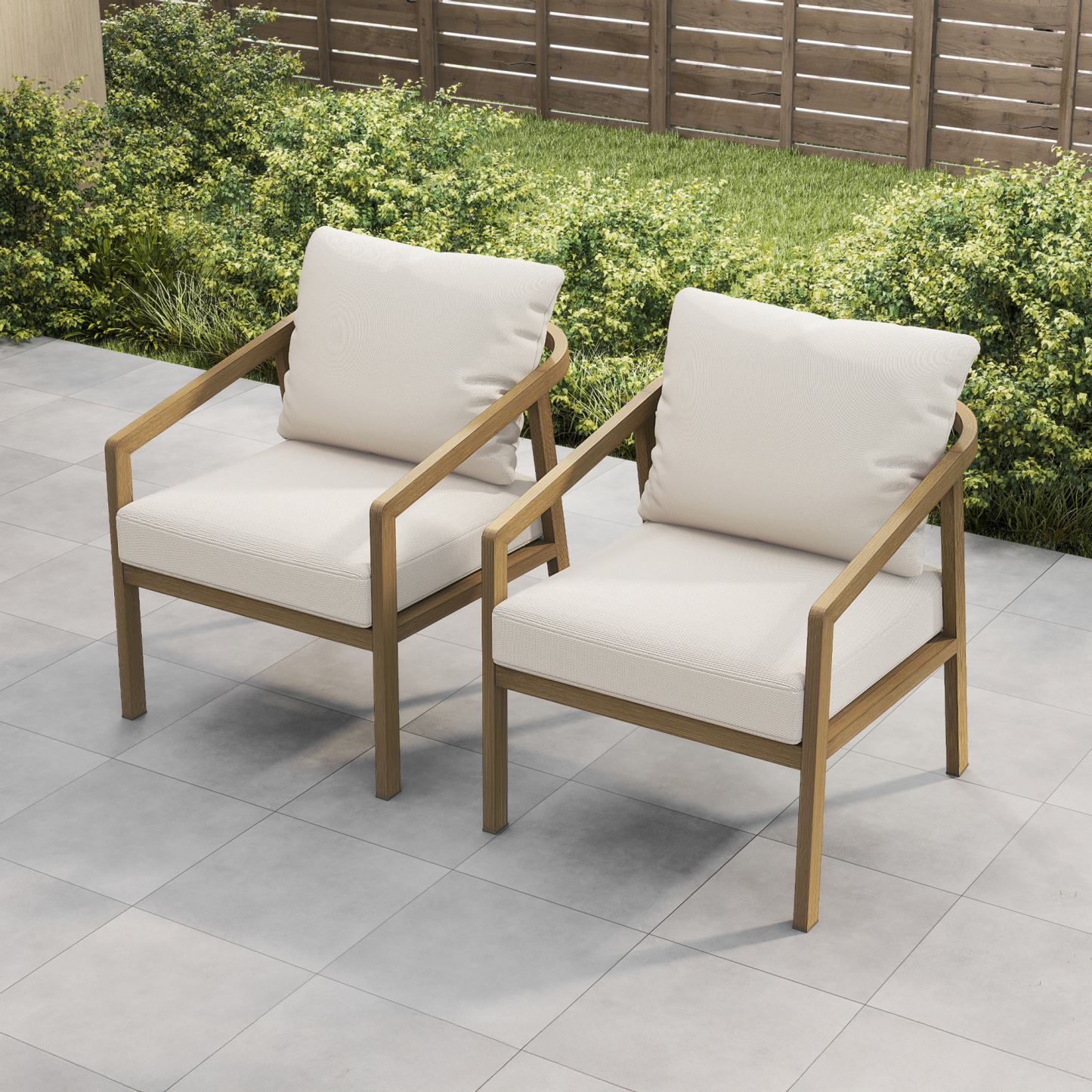Crafted with modern outdoor armchairs with wooden frames and cream cushions on a patio, this piece offers both comfort and style. - Seehill