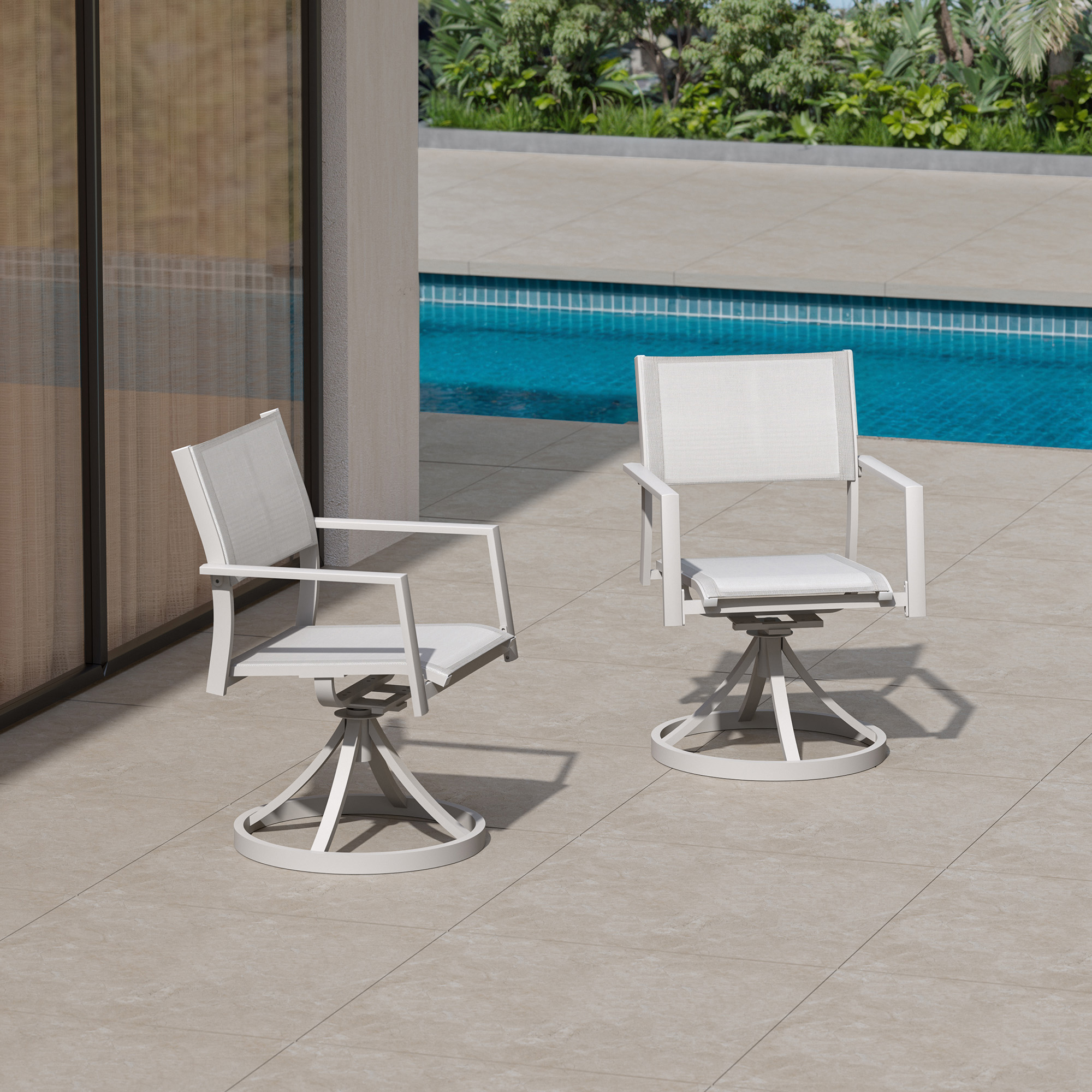 Two white stackable swivel patio dining chairs on tiled poolside patio-Seehill