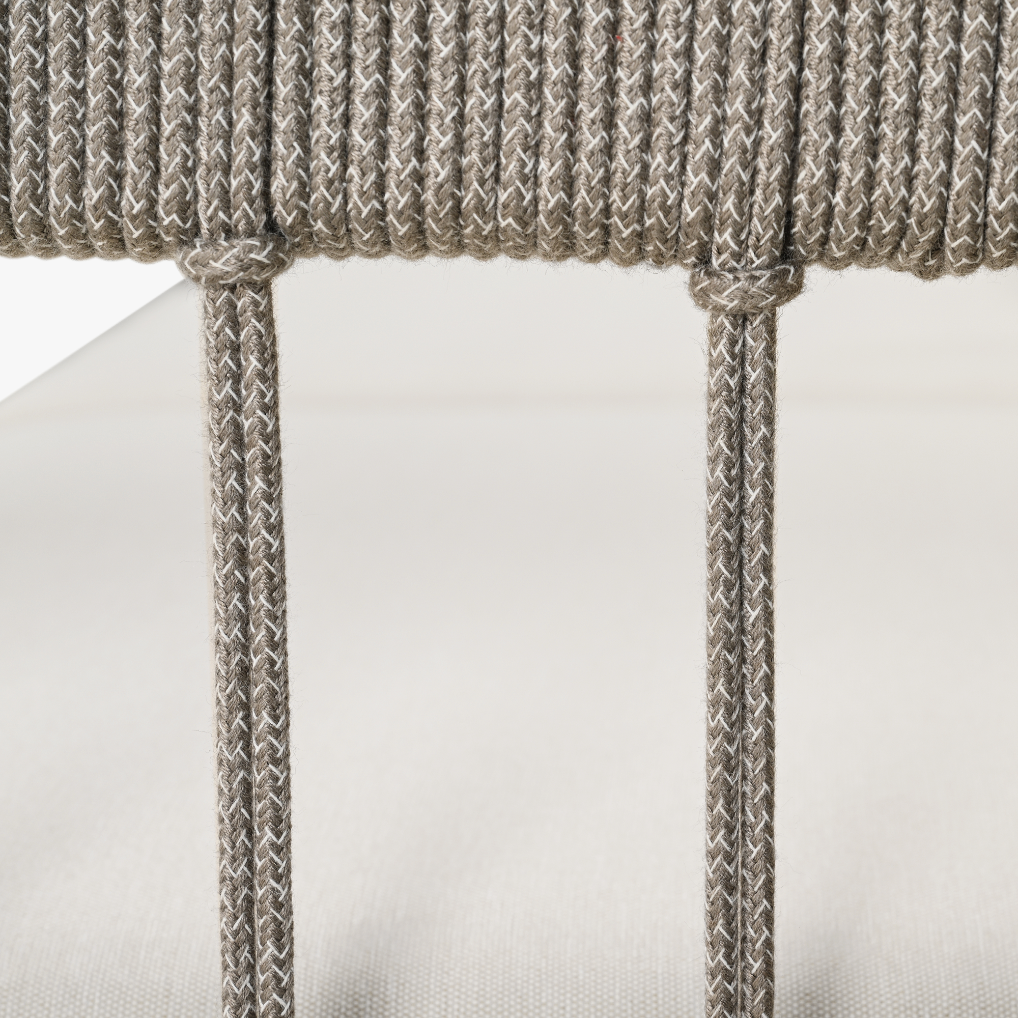 Close-up of woven rope detail on the frame of an outdoor patio sofa cushion-Seehill