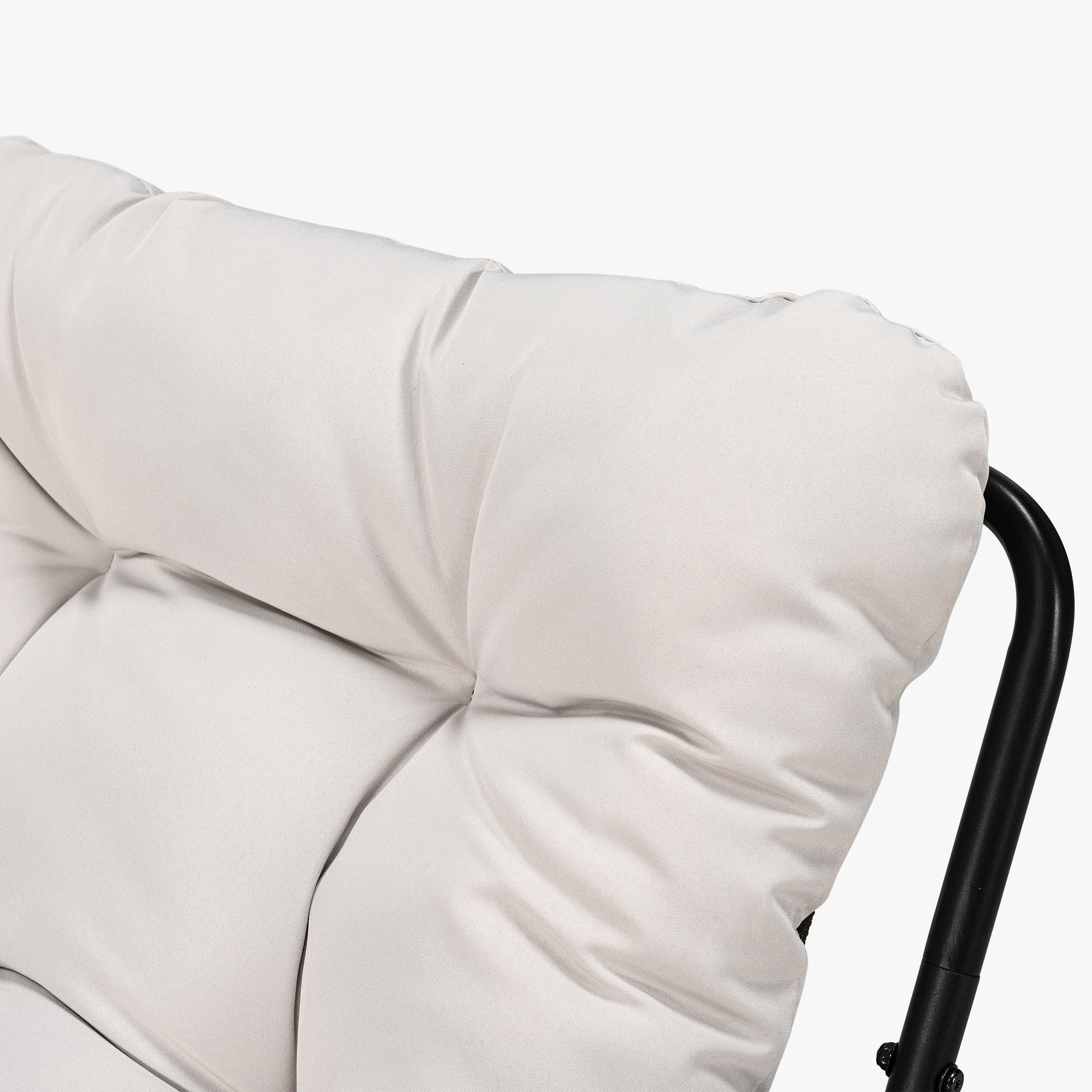 Close-up of plush white cushion on metal frame of modern patio rocking chair -Seehill