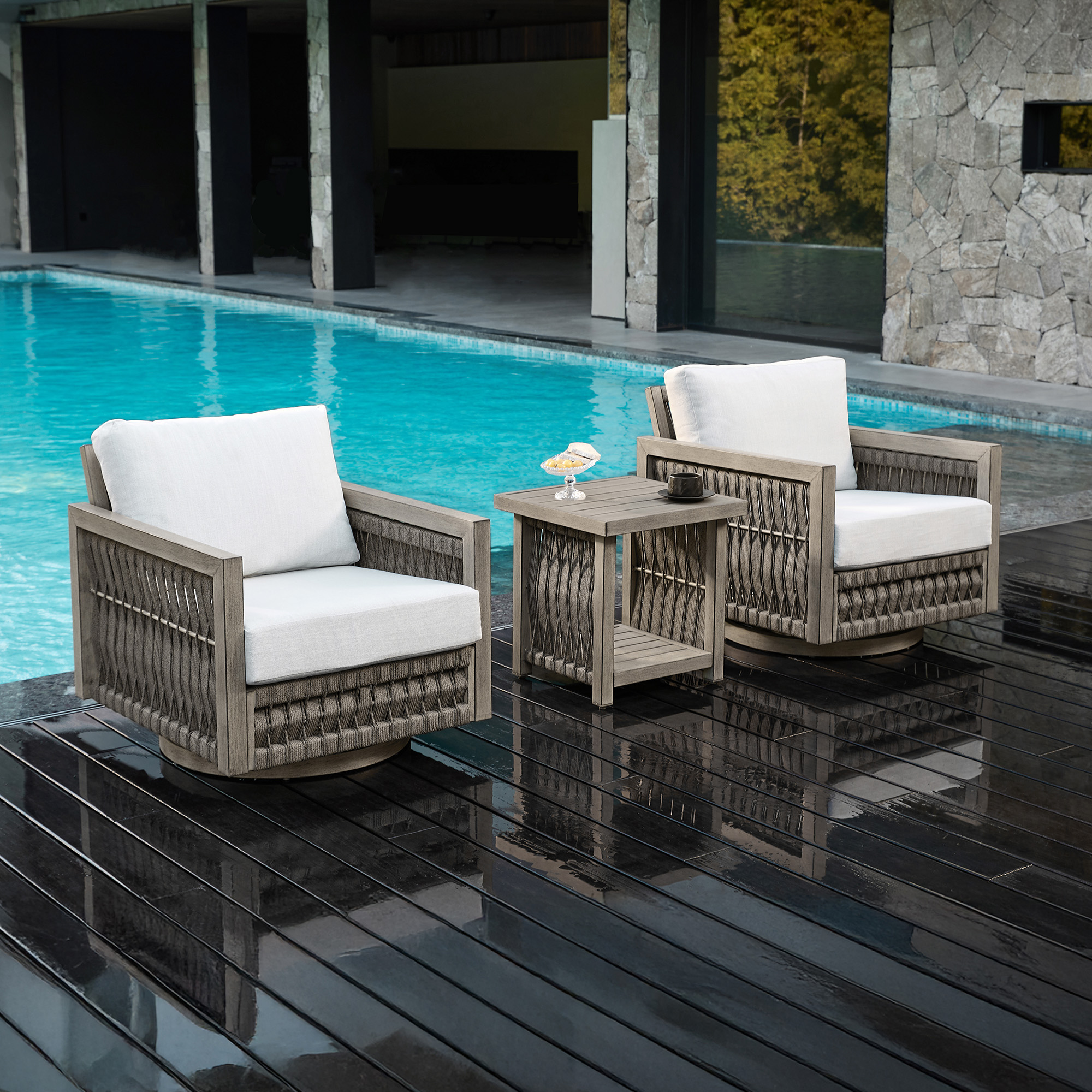 Explore the modern outdoor swivel chairs with woven texture and white cushions of the exclusive outdoor patio. - Seehill