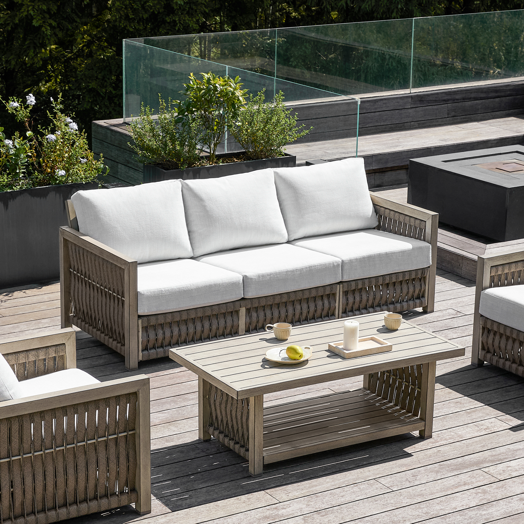 Outdoor wicker sofa set with white cushions, wooden frame, and matchin - Seehill