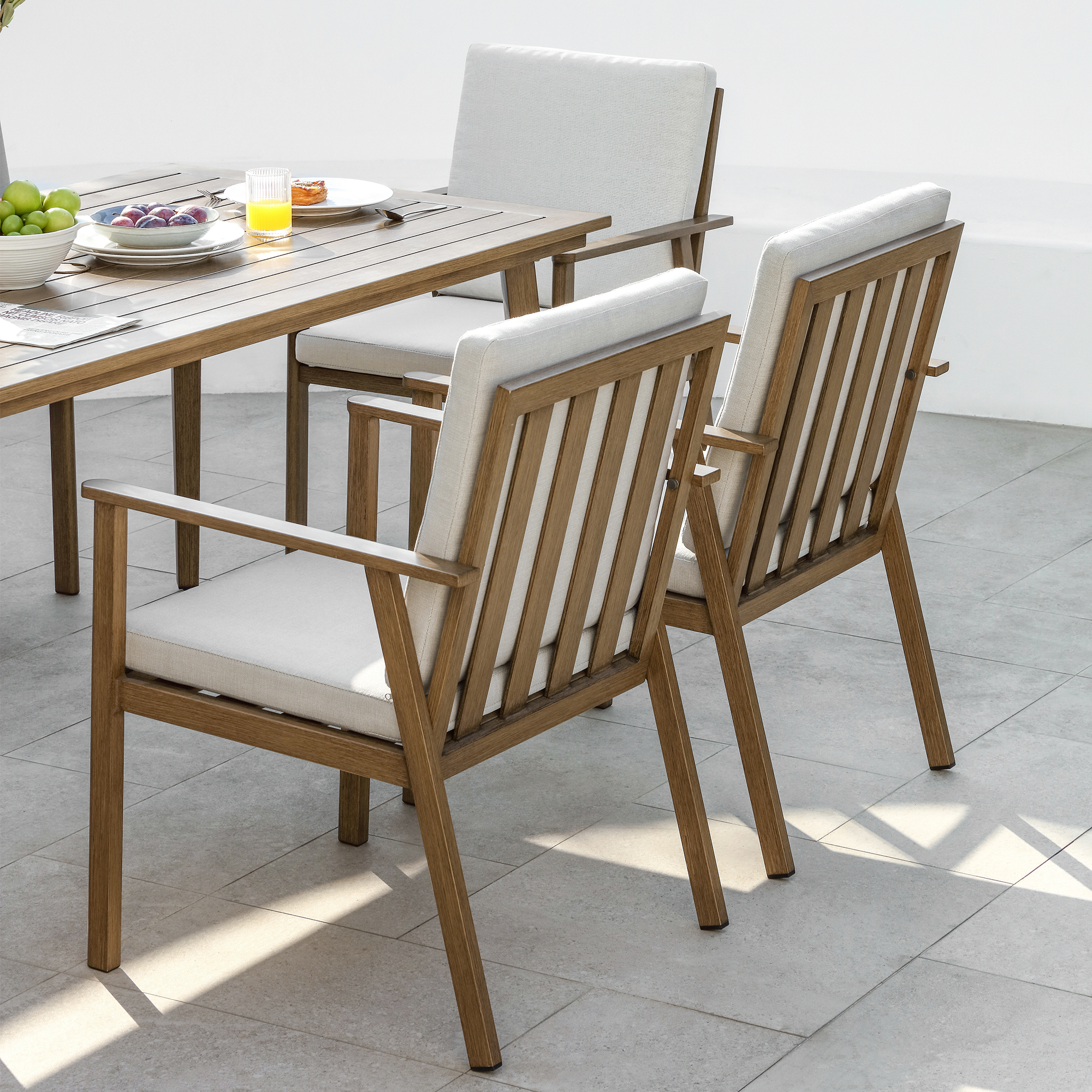A sophisticated Piece outdoor patio dining set made of aluminum all-weather furniture with an umbrella hole and comfortable chairs. - Seehill