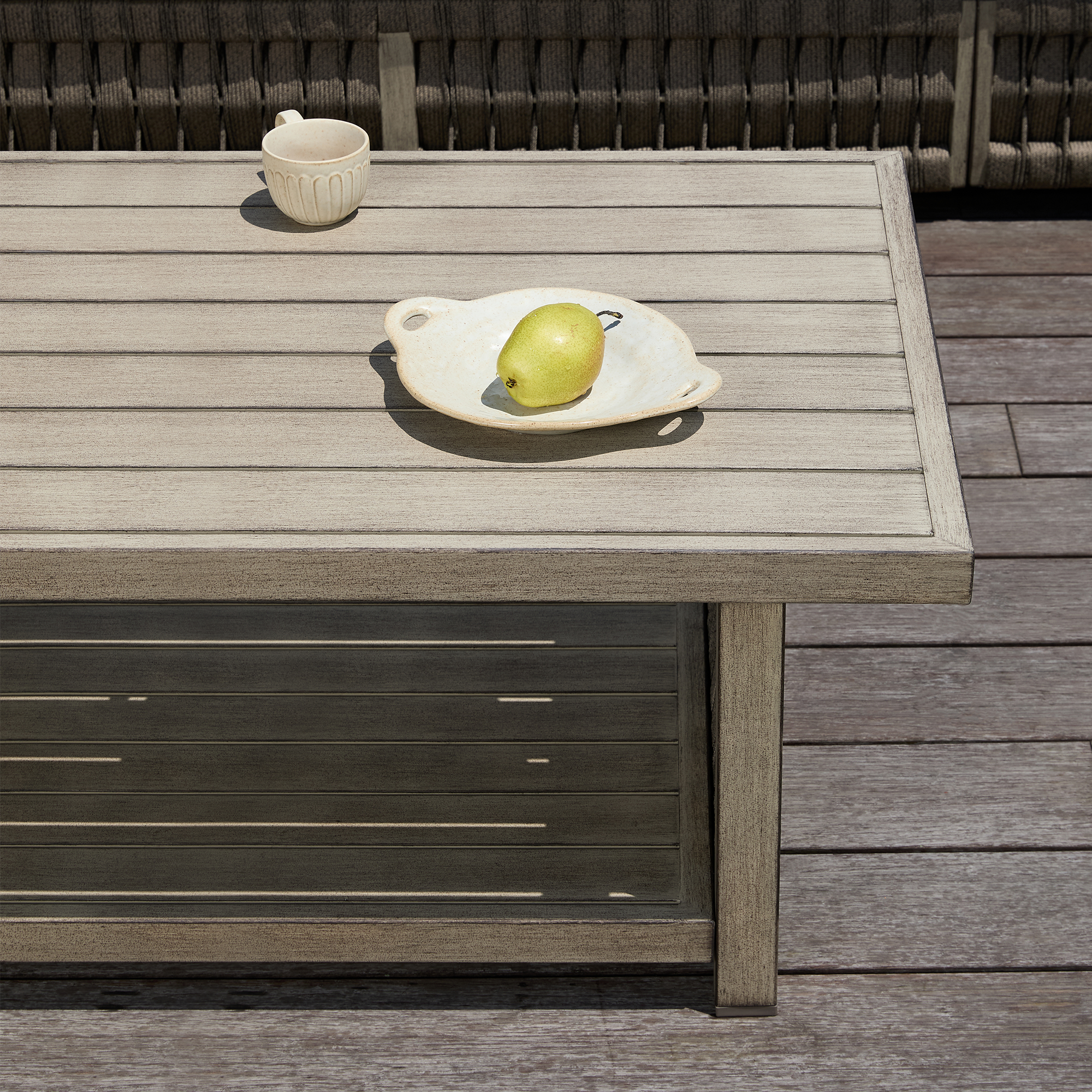 An elegant outdoor patio coffee table with an aluminum frame, rope weave design, and tiered storage. - Seehill