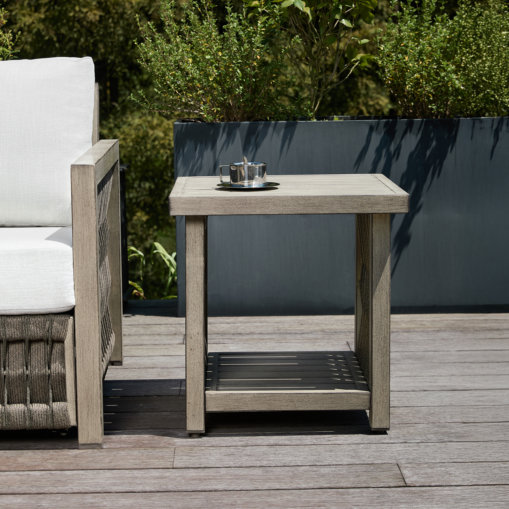 An elegant outdoor patio side table with aluminum frame, tiered rope weave design, and adjustable legs perfect for modern living. - Seehill