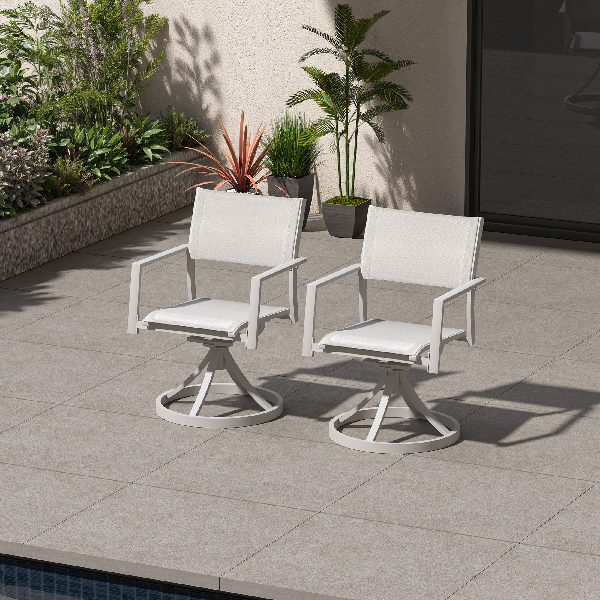 Two white stackable swivel patio dining chairs on a tiled poolside patio-Seehill