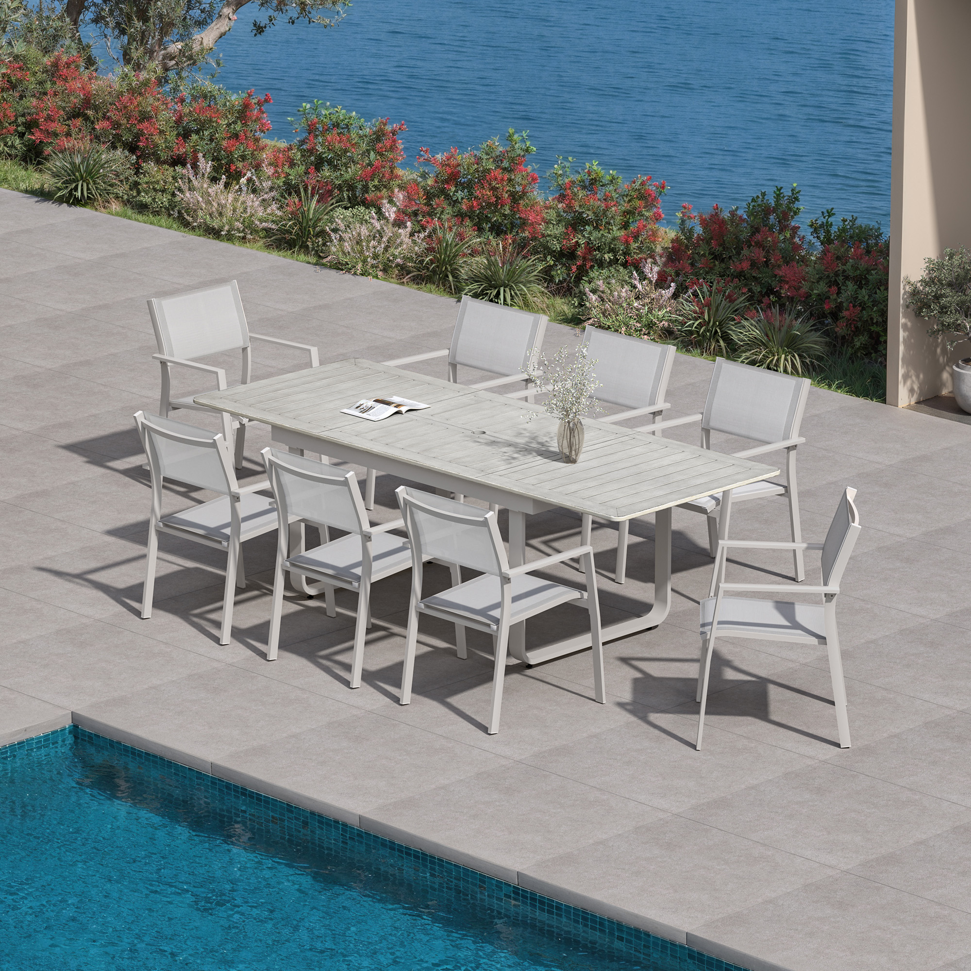 Extendable outdoor dining set with nine pieces arranged by a poolside patio-Seehill