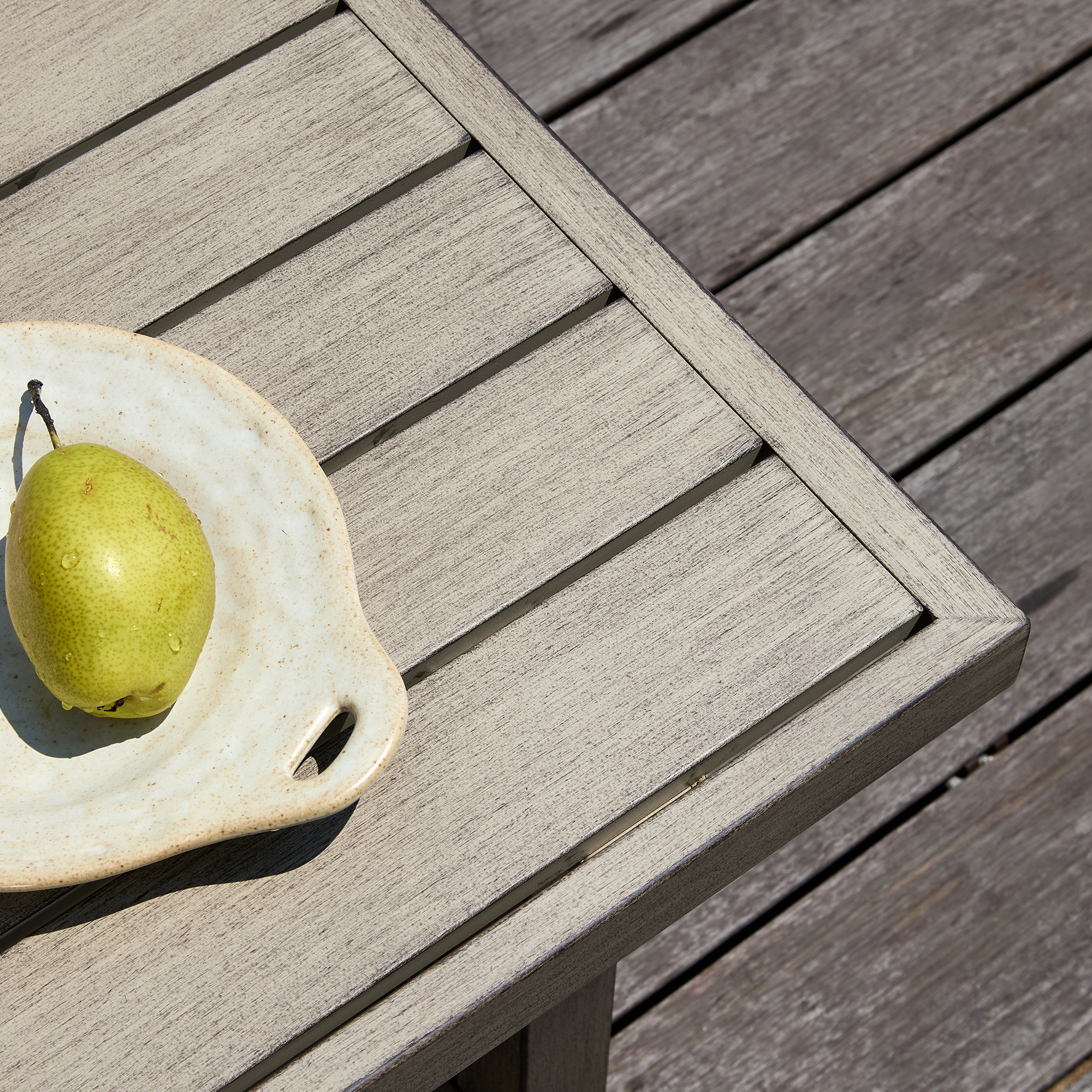 Weathered gray outdoor table with slatted top  - Seehill