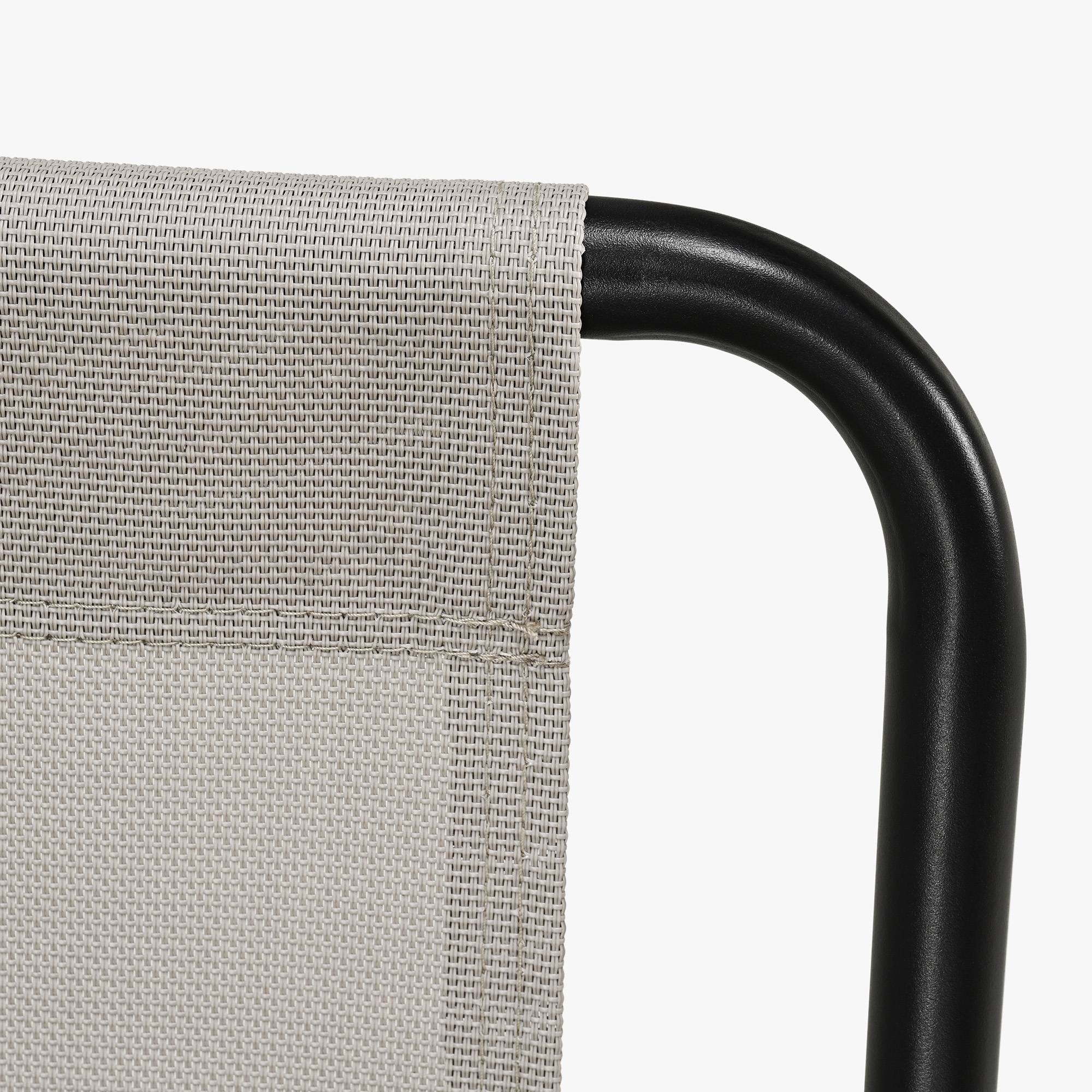 Close-up of black metal frame and woven fabric seat detail of modern patio rocking chair -Seehill