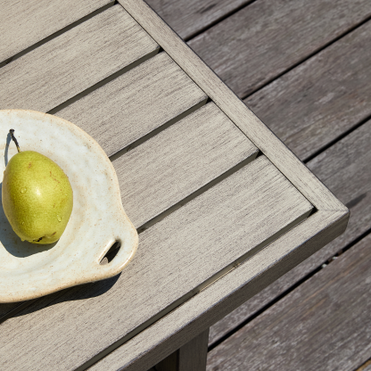 Weathered gray outdoor table with slatted top  - Seehill