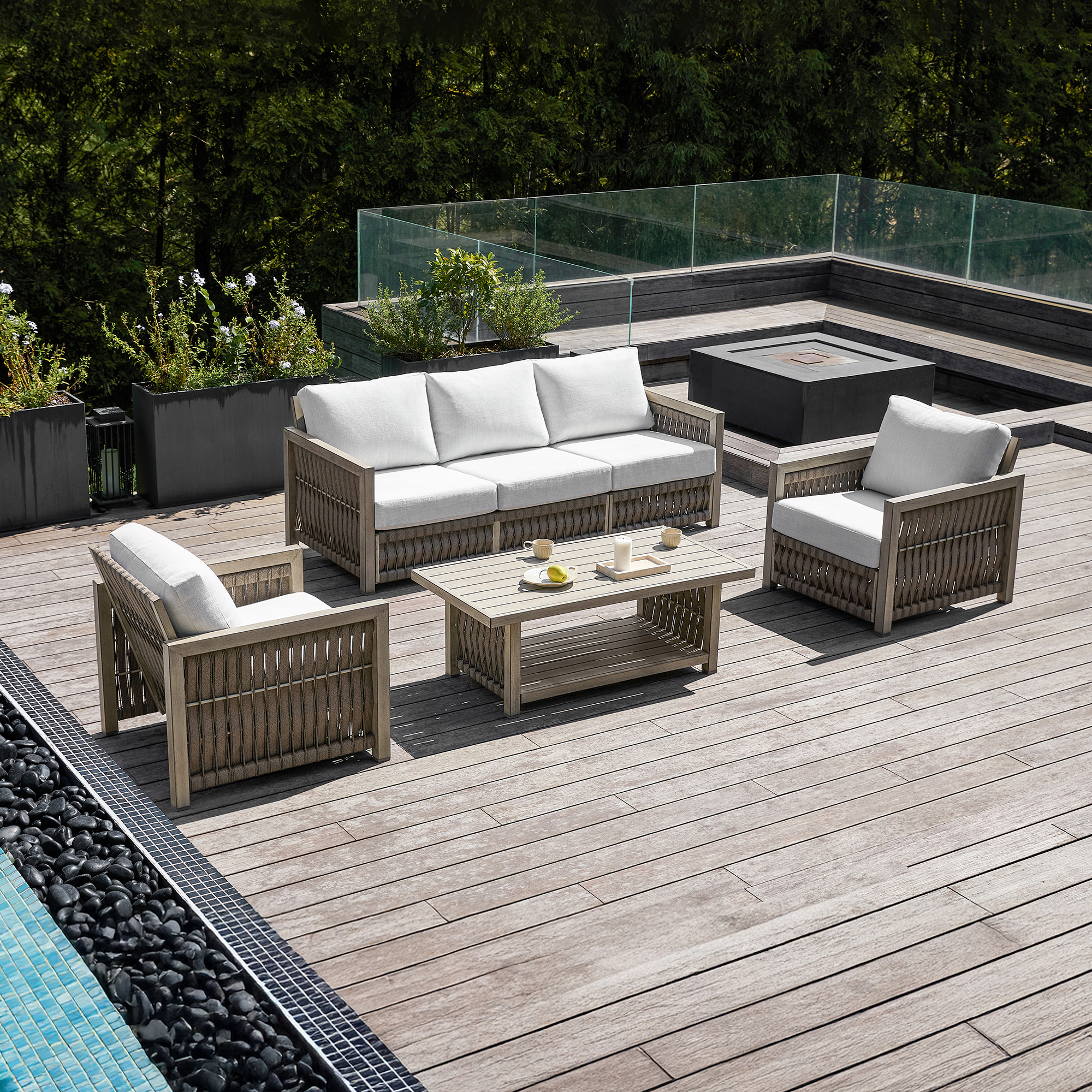 Explore the modern rattan patio set with white cushions and a glass top, perfect for a graceful outdoor patio. - Seehill