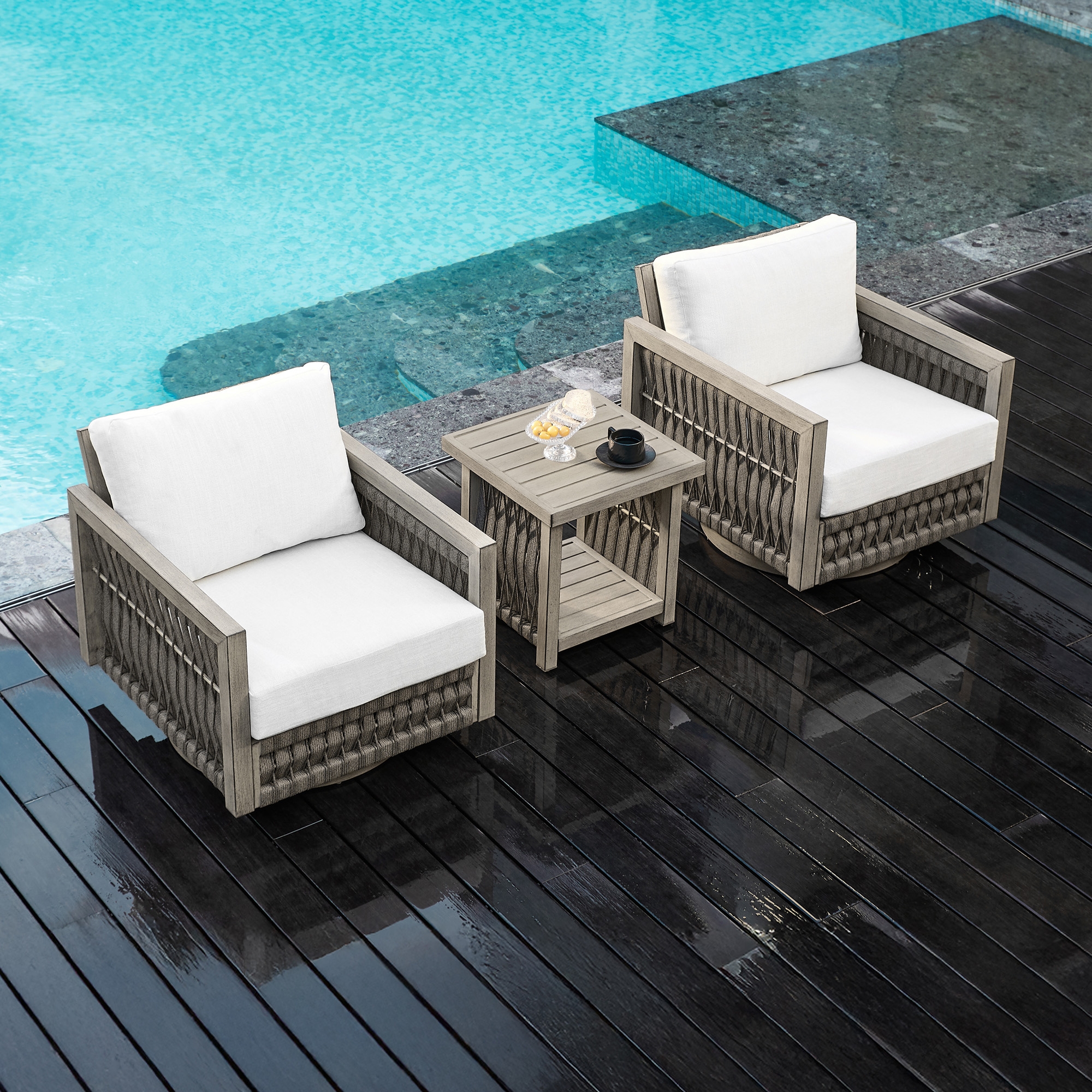 Crafted with a weather-resistant wicker lounge set with white cushions, this outdoor patio provides durability and elegance. - Seehill