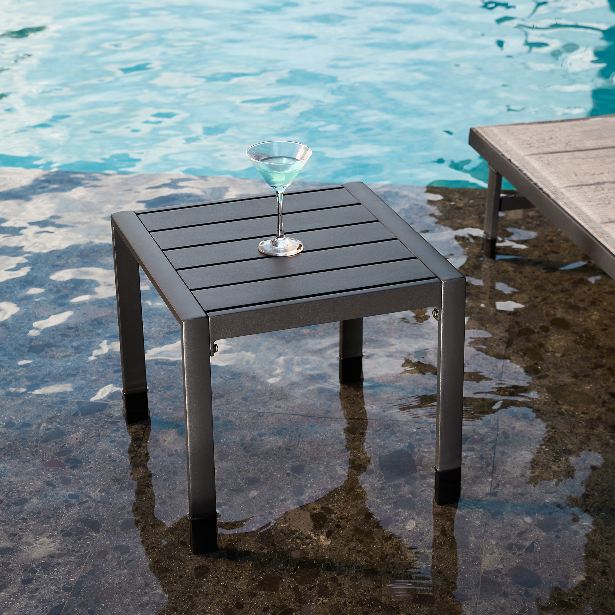 This exclusive Outdoor Side Table – Rustproof Aluminum & Slatted Top features a modern black outdoor design. - Seehill