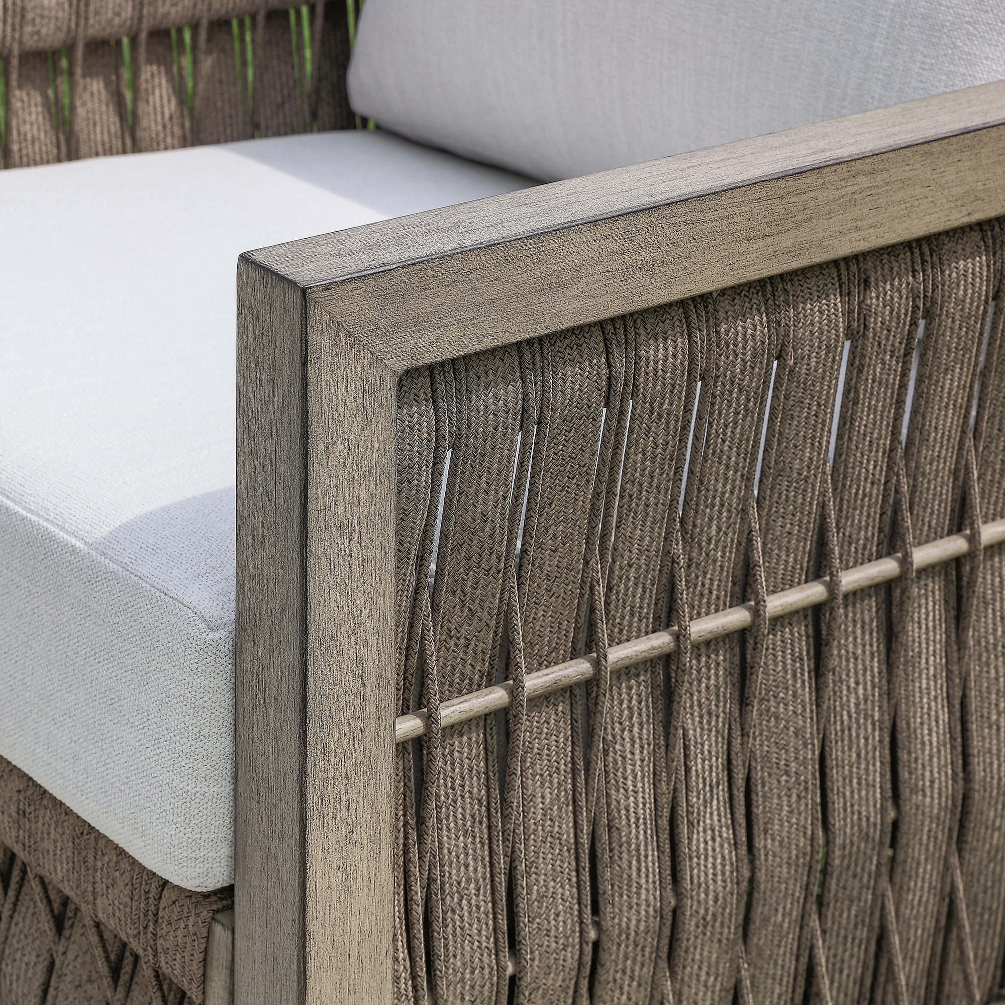 A premium Oversize Rope Weave Outdoor Sofa design includes an outdoor wicker sofa with gray cushions. - Seehill
