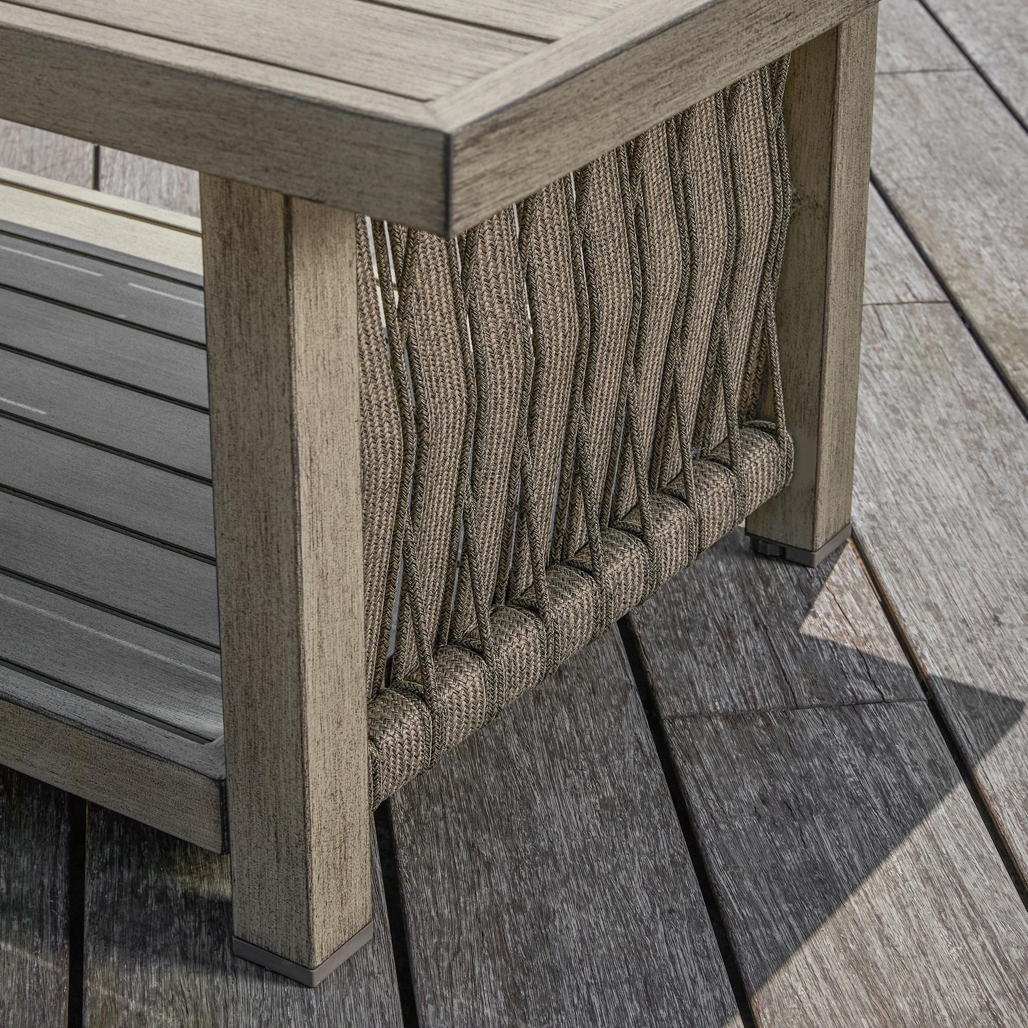 This graceful outdoor patio coffee table features an aluminum frame, rope weave design, and tiered storage. - Seehill