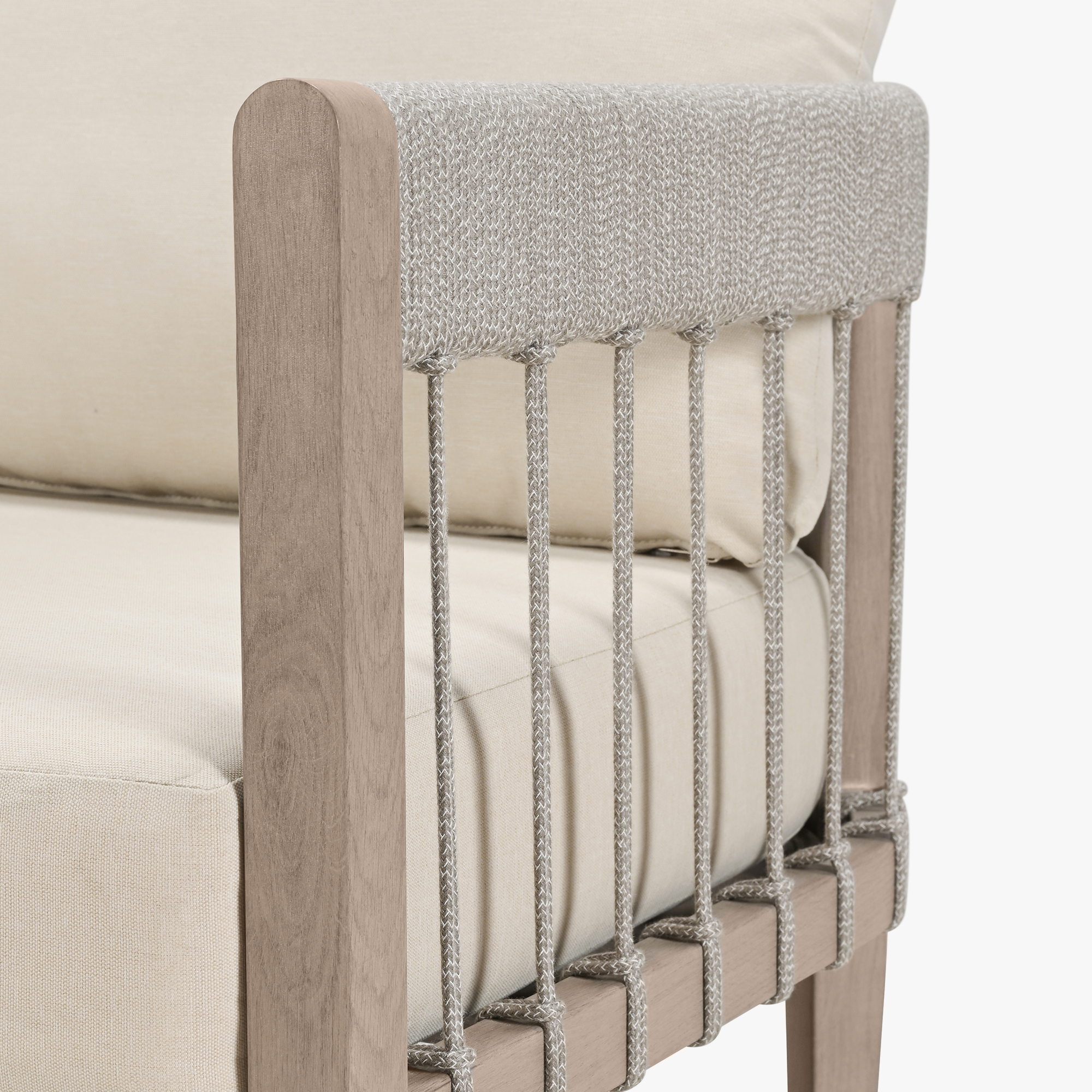 Close-up of patio sofa armrest with faux wood grain and woven rope detailing-Seehill