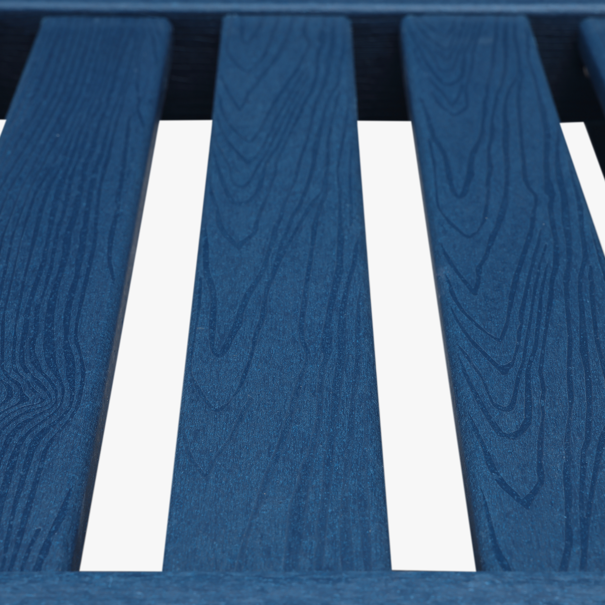 Close-up of blue HDPE patio lounge slats showing wood grain texture on white background -Seehill