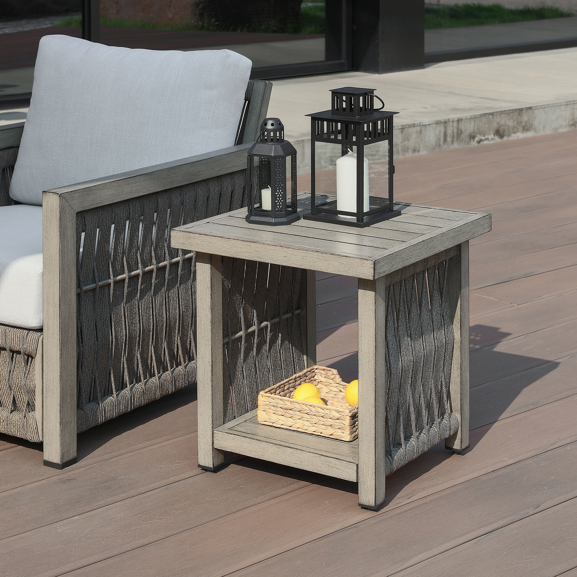 Highlighting the outdoor side table with woven panel and storage shelf of this refined Outdoor Patio collection. - Seehill