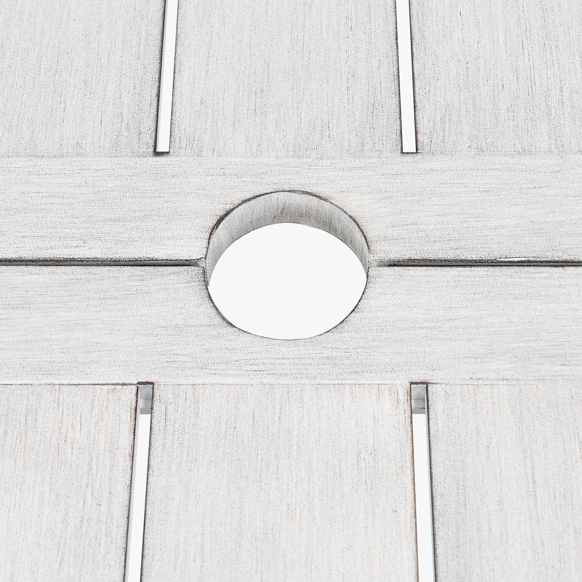 Close-up of whitewashed wood outdoor dining table with circular umbrella hole-Seehill