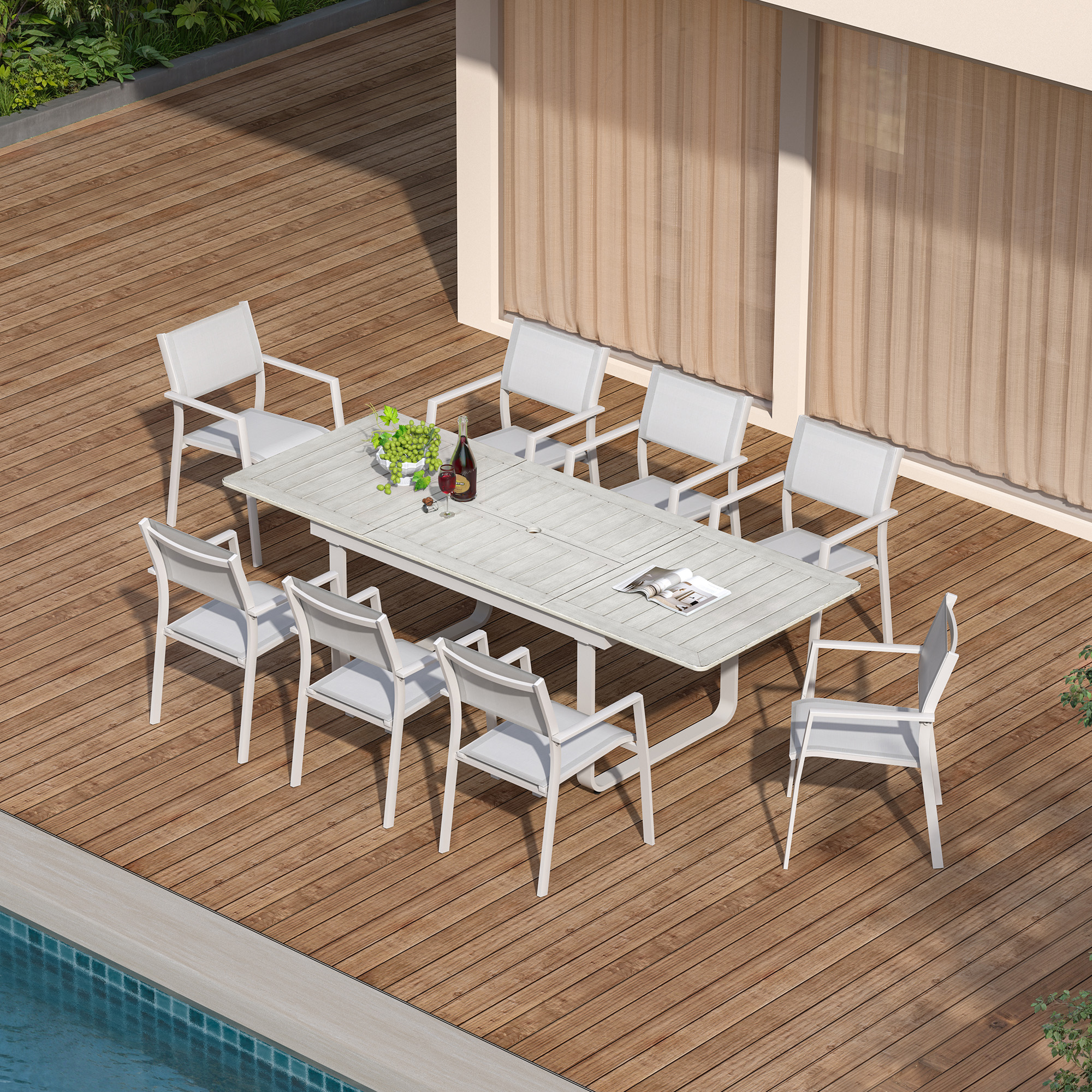 Extendable outdoor dining set with white chairs on wooden deck by pool -Seehill