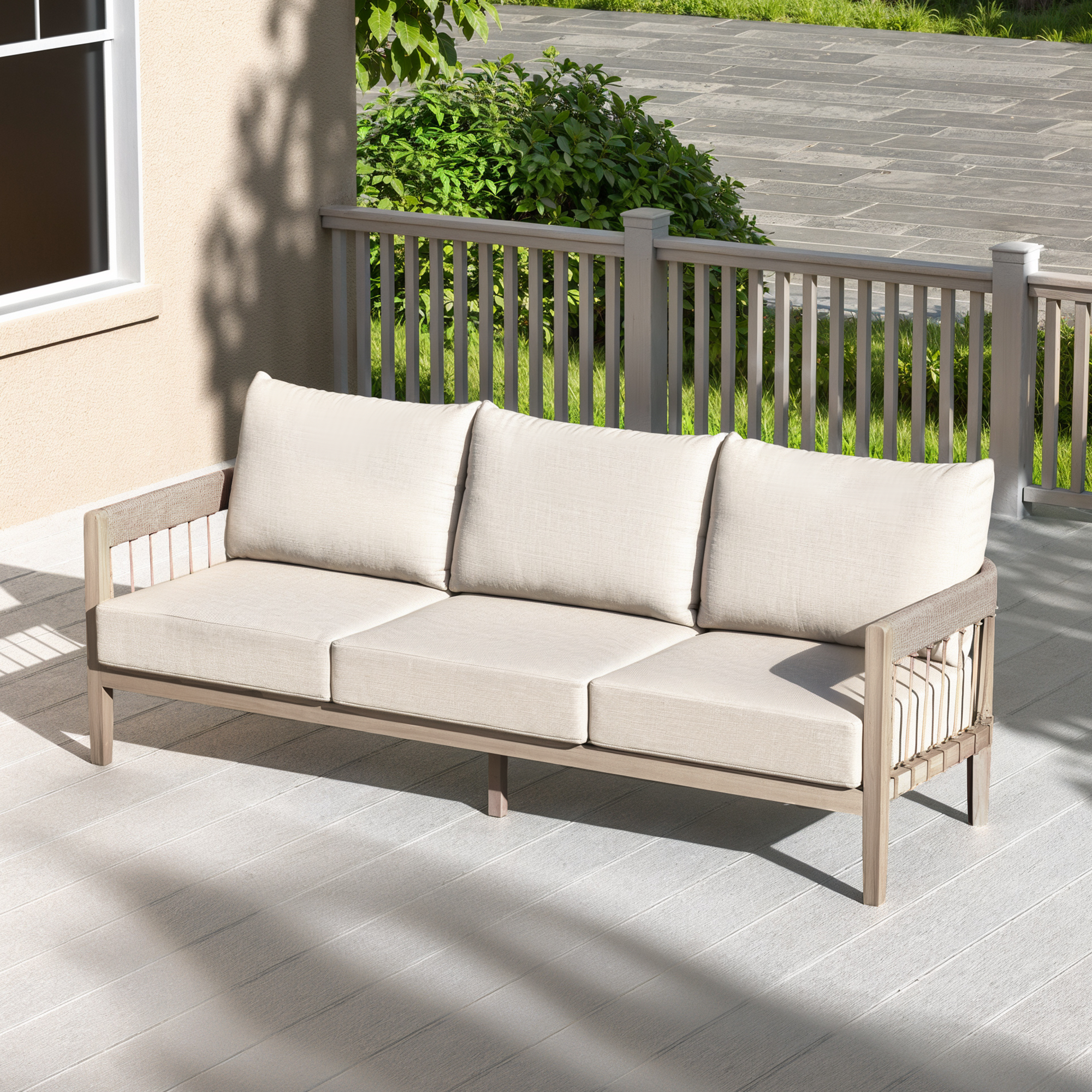 Outdoor patio sofa with light beige cushions and faux wood grain frame on a sunny deck-Seehill