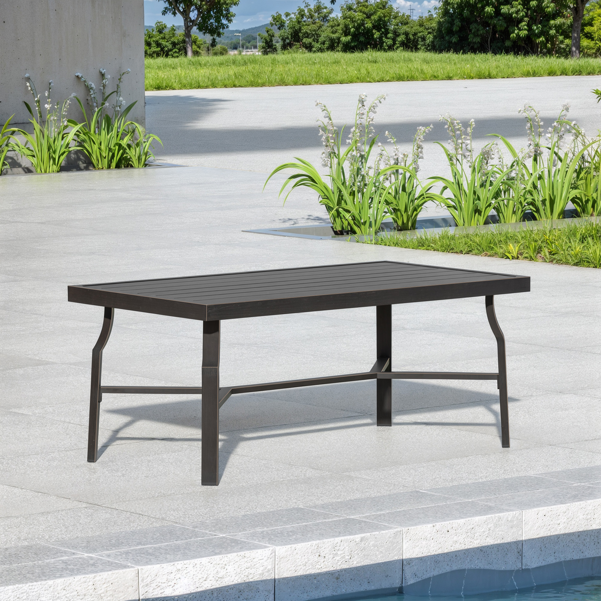 Outdoor patio coffee table with a slatted top set beside a pool on a sunny day-Seehill
