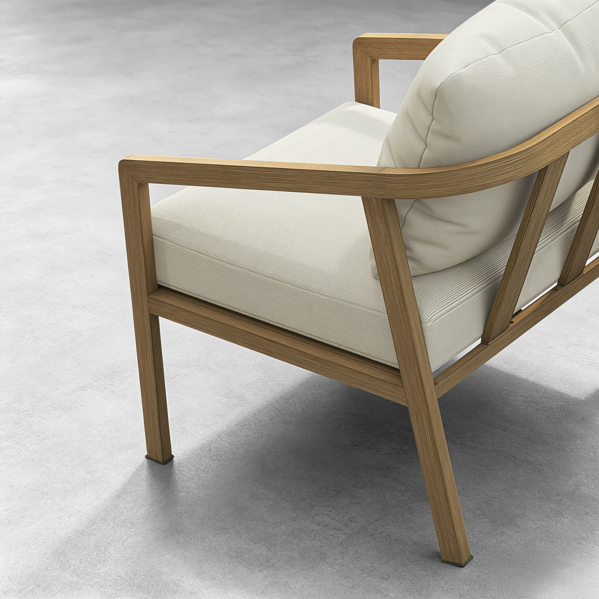 Close-up of wooden frame and white cushioned seat of outdoor patio armchair on gray floor-Seehill
