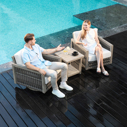 Modern outdoor wicker armchairs with white cushions and side table - Seehill