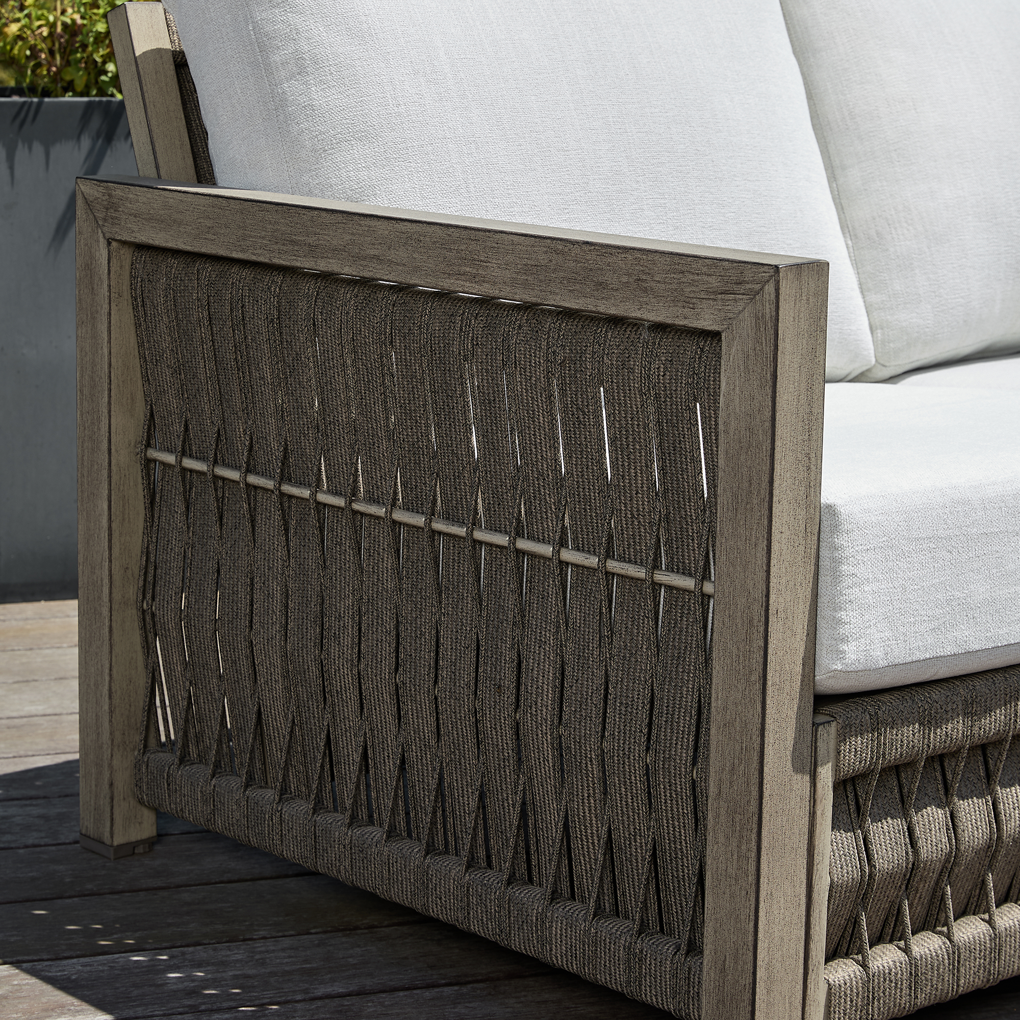This is an artistic Seater Outdoor Patio Sofa with an aluminum frame, rope weave design, and washable cushions. - Seehill