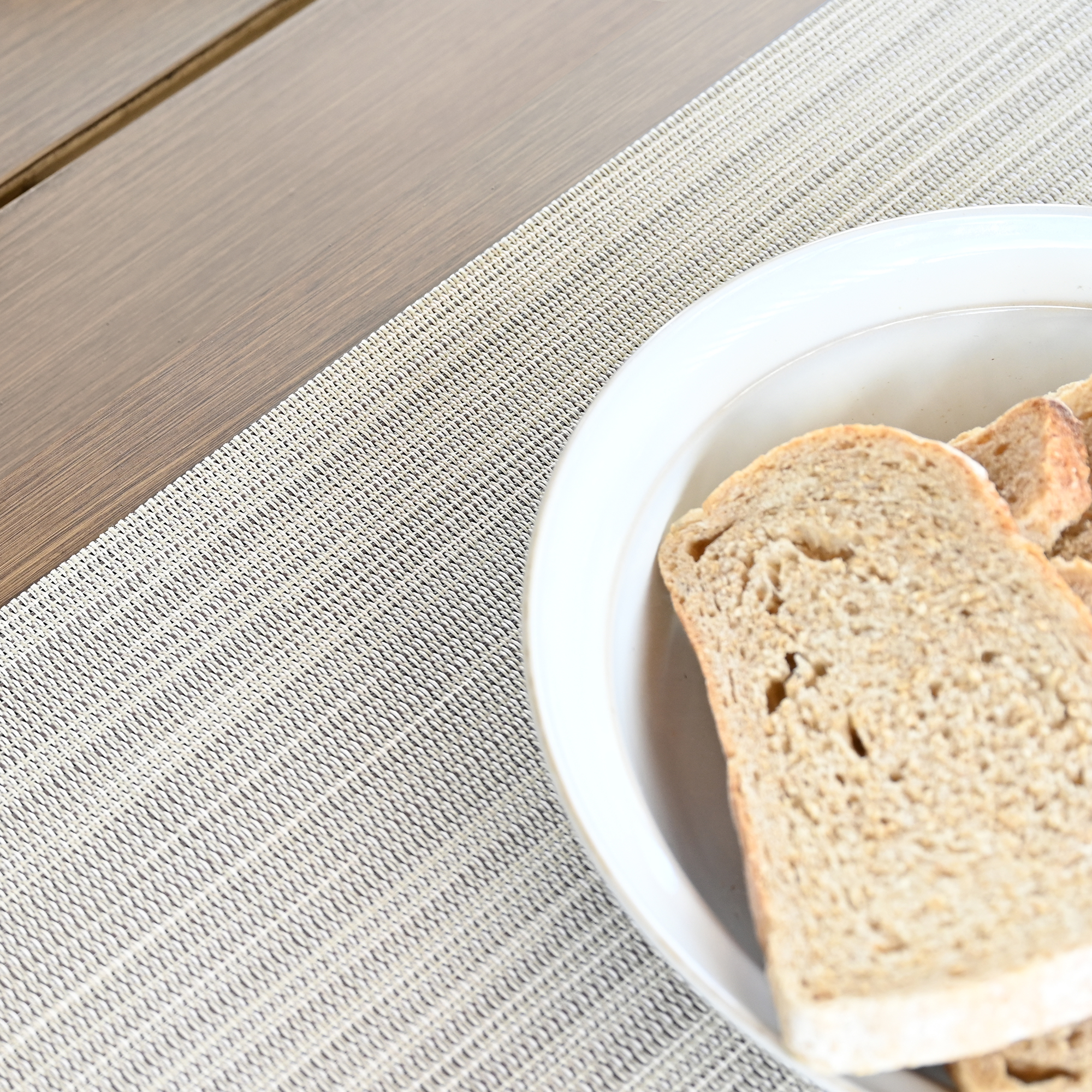 Modern versatile clean look placemats highlighting a set of four beige clean look placemats. - Seehill