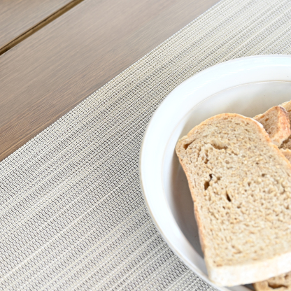 Modern versatile clean look placemats highlighting a set of four beige clean look placemats. - Seehill