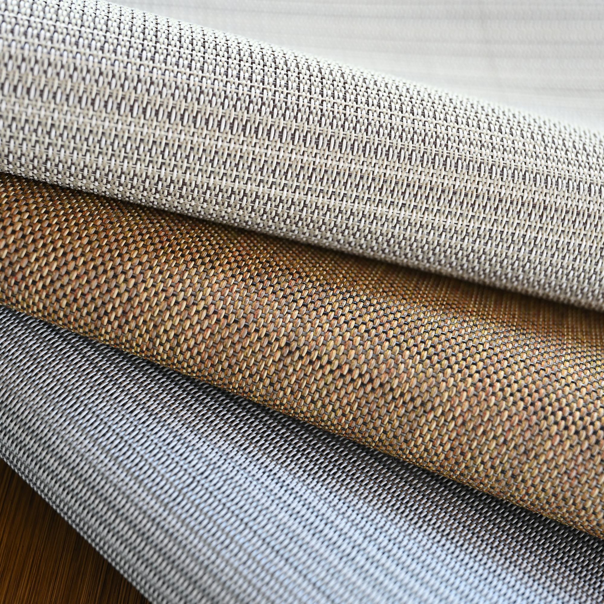 A luxury versatile clean look placemats design presenting a set of sleek, neutral-toned placemats. - Seehill