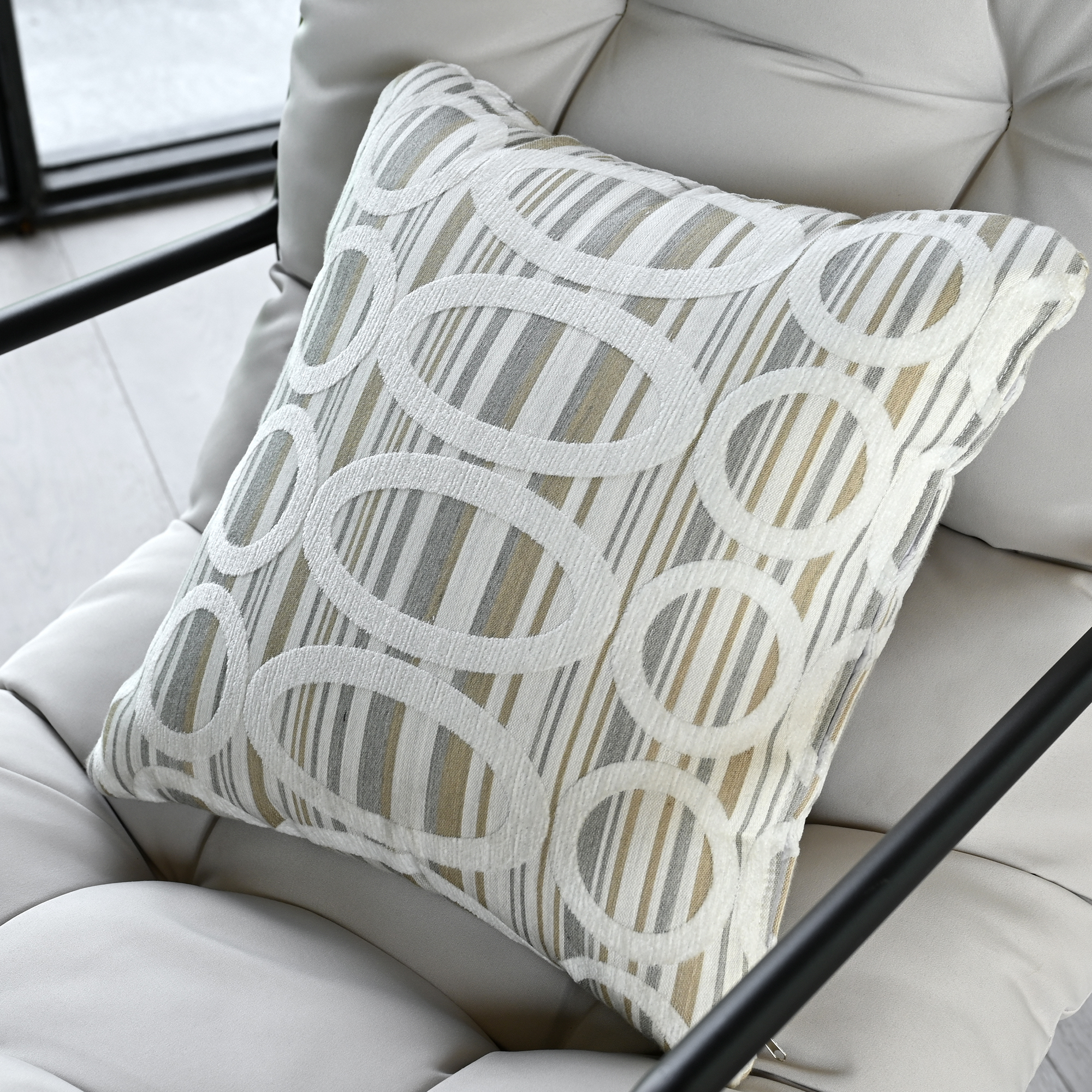 Experience the square weather-resistant outdoor throw pillow with textured beige fabric and subtle detailing. - Seehill