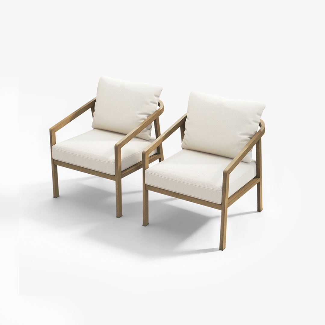 Experience the two beige cushioned armchairs with dark metal frames set on a wooden deck, providing a modern seating option. - Seehill