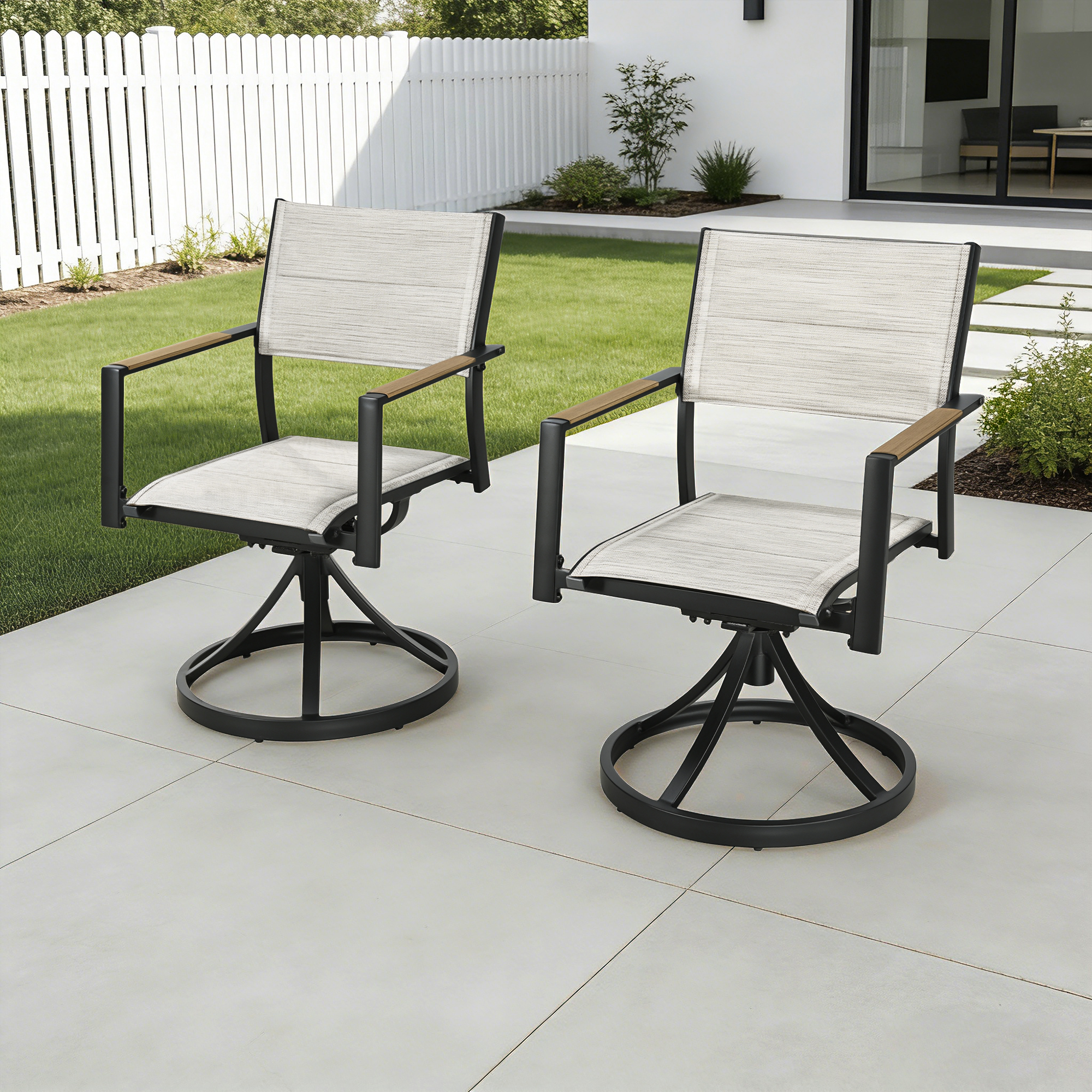 Two beige fabric patio swivel dining chairs with black metal frames on a tiled patio-Seehill